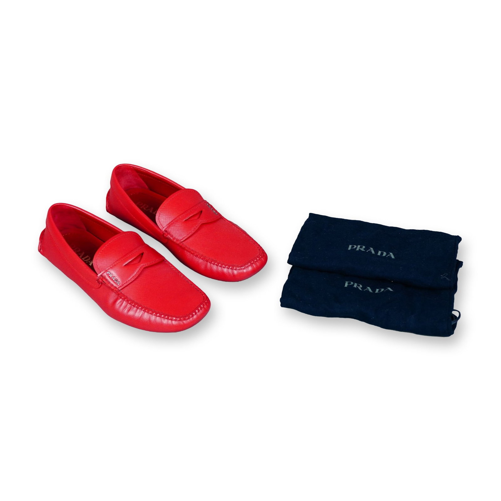 Prada Red Saffiano Leather Driving Loafers: Prada red Saffiano leather penny driving loafers, model code 2DD001, size US 8. The pair features textured Saffiano leather uppers with classic penny loafer straps, red leather insoles, and black rubb