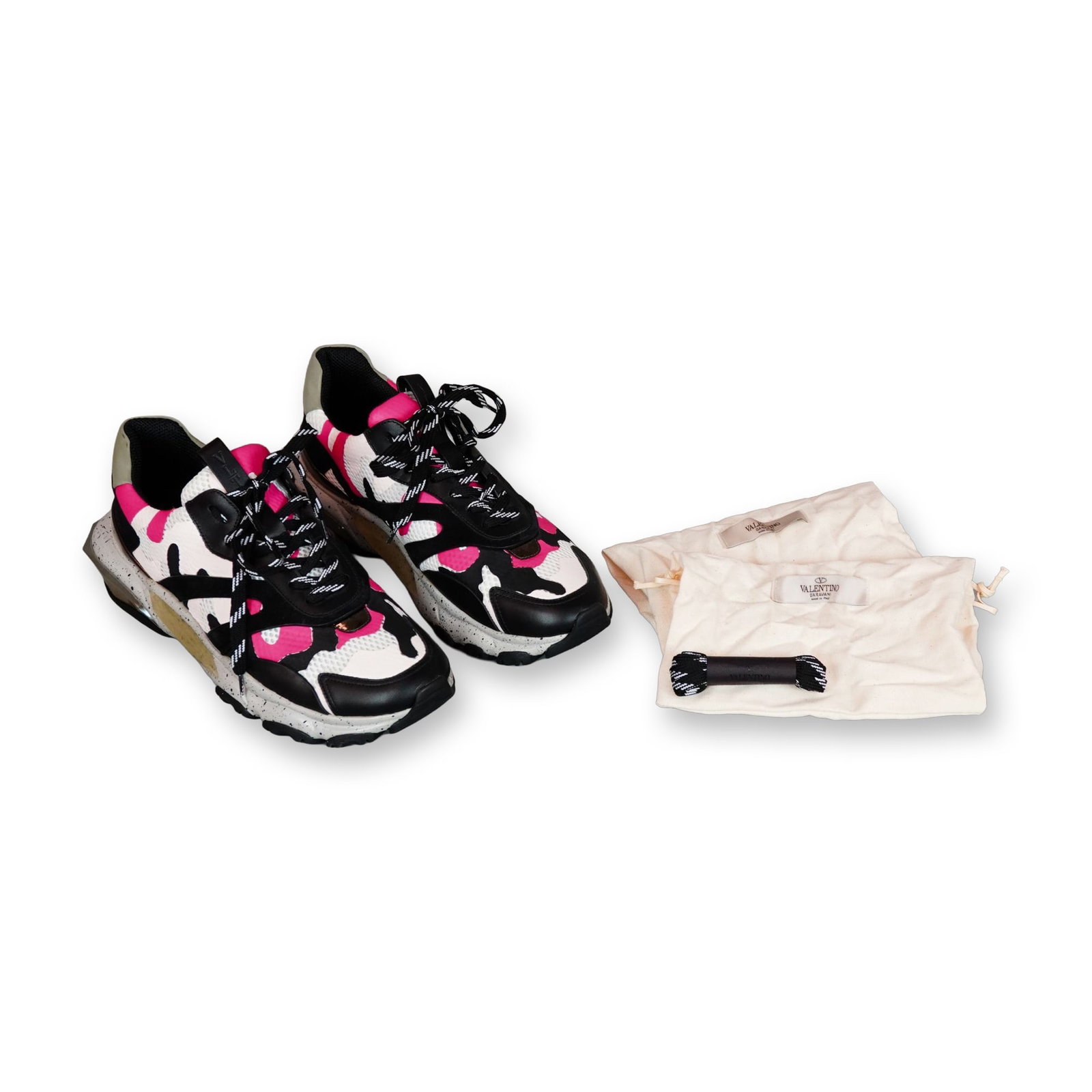Valentino Garavani Bounce Camouflage Sneakers Size 43: Valentino Garavani Bounce chunky low-top sneakers in a pink, black, and white camouflage print, size EU 43 (approximate US men's size 10). Built with leather, suede, and mesh textile uppers, the desig