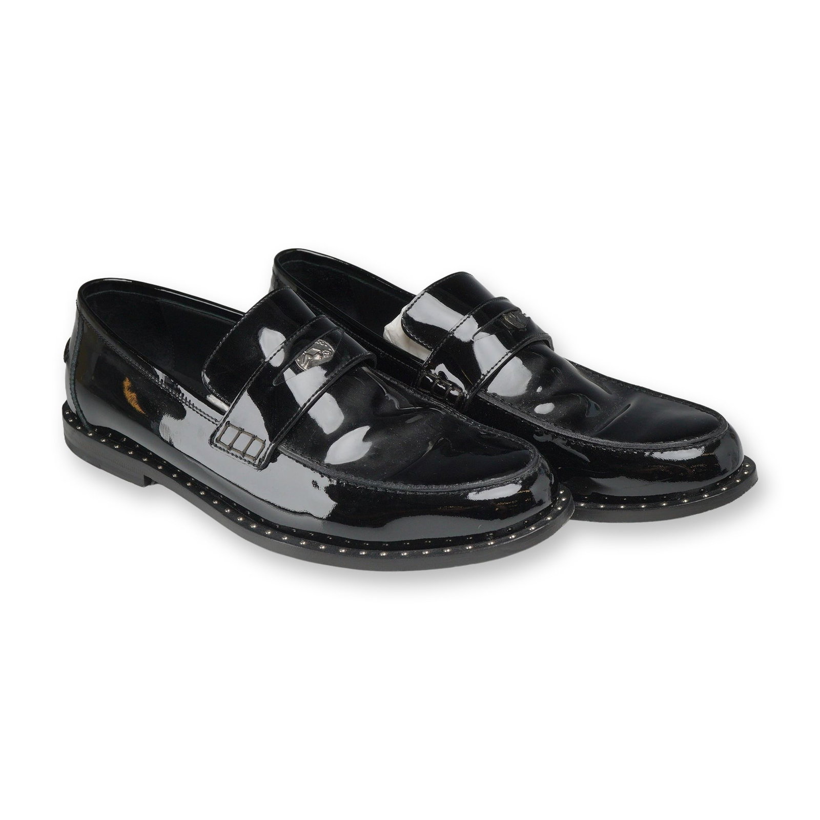 Pair of Jimmy Choo Darby Studded Patent Leather Loafers: Pair of Jimmy Choo Darby studded penny loafers in black patent leather, styled as tuxedo shoes. The uppers feature a classic penny keeper strap inset with silver-tone commemorative coins displaying a 