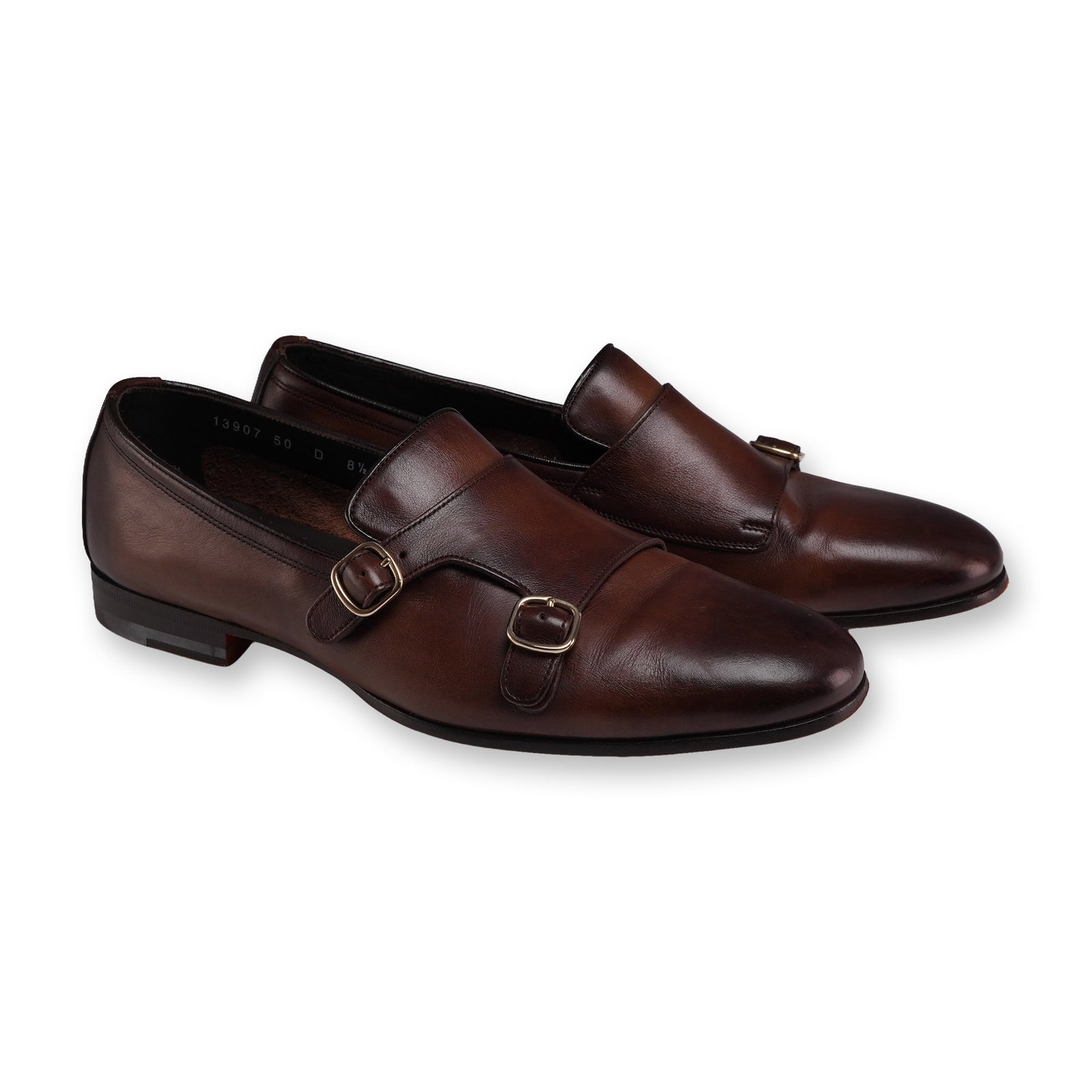 Pair of Santoni 13907 50 Men's Leather Monk Strap Shoes: Santoni pair of men's double monk strap shoes in burnished dark brown leather. Constructed with leather uppers and leather linings, the design features dual gold-tone buckles on a strap closure. Outso