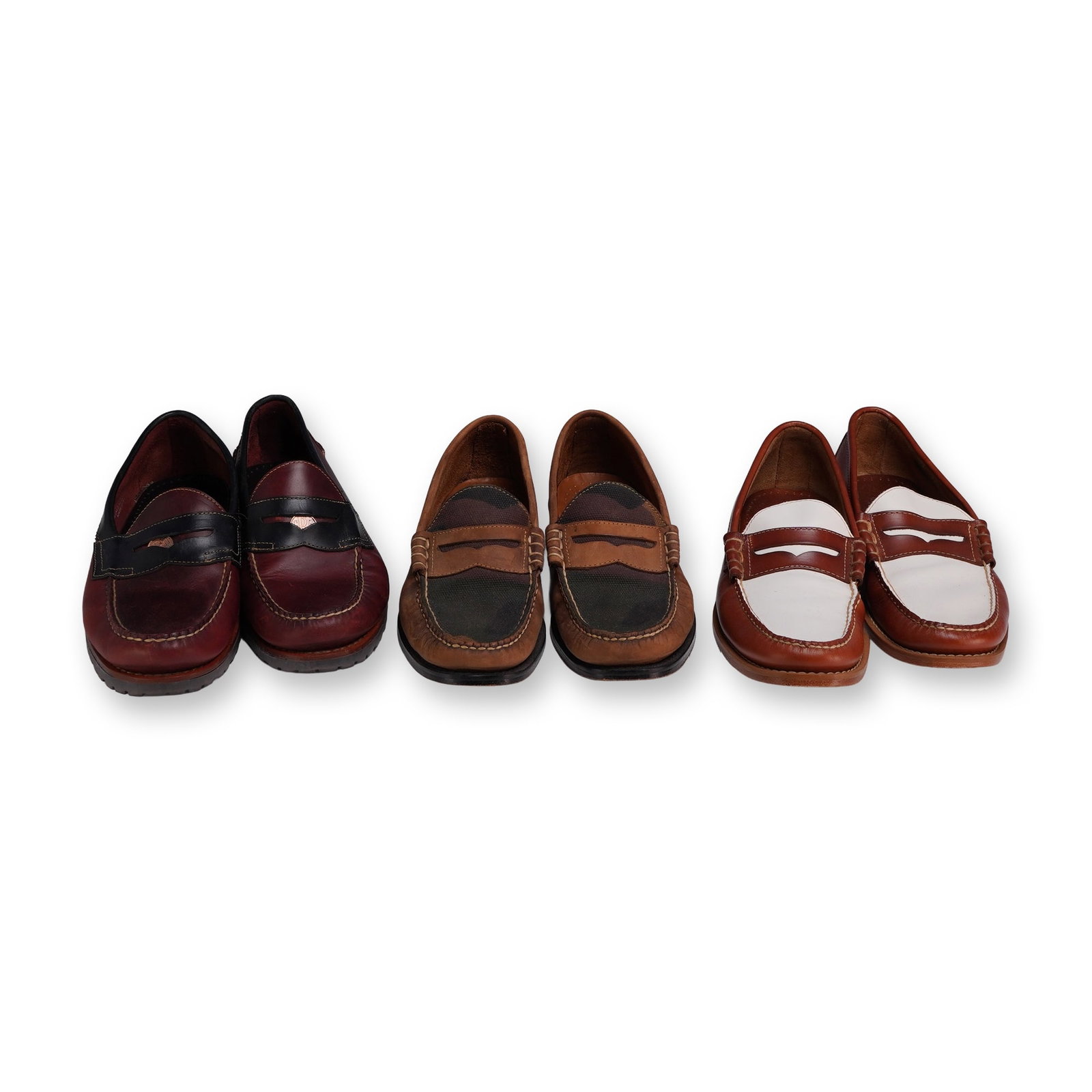 3 Pairs G.H. Bass and Co. Weejuns Penny Loafers: G.H. Bass and Co. Three pairs of men's Weejuns penny loafers, all size 9, featuring leather uppers and assorted sole constructions. The group includes model 70 79032 lug sole loafers in two-tone burgu