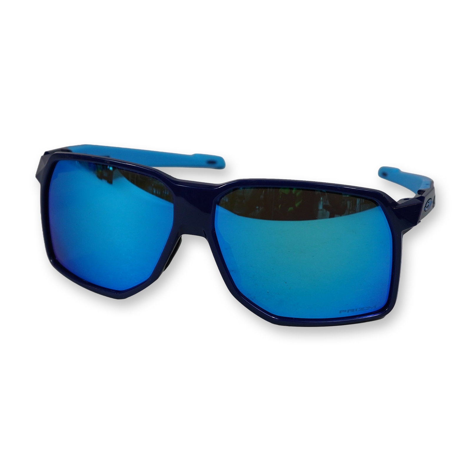 Oakley Portal Prizm Sapphire Sunglasses: Oakley. Portal model sunglasses featuring a two-tone navy and light blue O Matter frame with Prizm Sapphire mirrored lenses. The sport-performance design includes an interchangeable black rubberized n