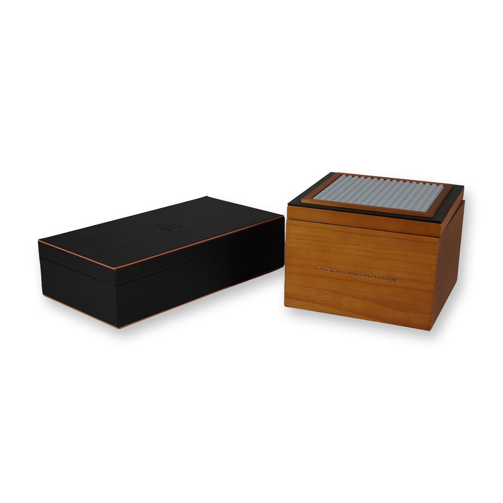 2pc Marriott Bonvoy Ambassador Elite Member Gift Sets: Two gift sets sent to loyalty members, a building block set of the JW Marriott Marquis in Dubai, presented in a wooden box, and a gaming set including two decks of cards and a glass die, presented in 