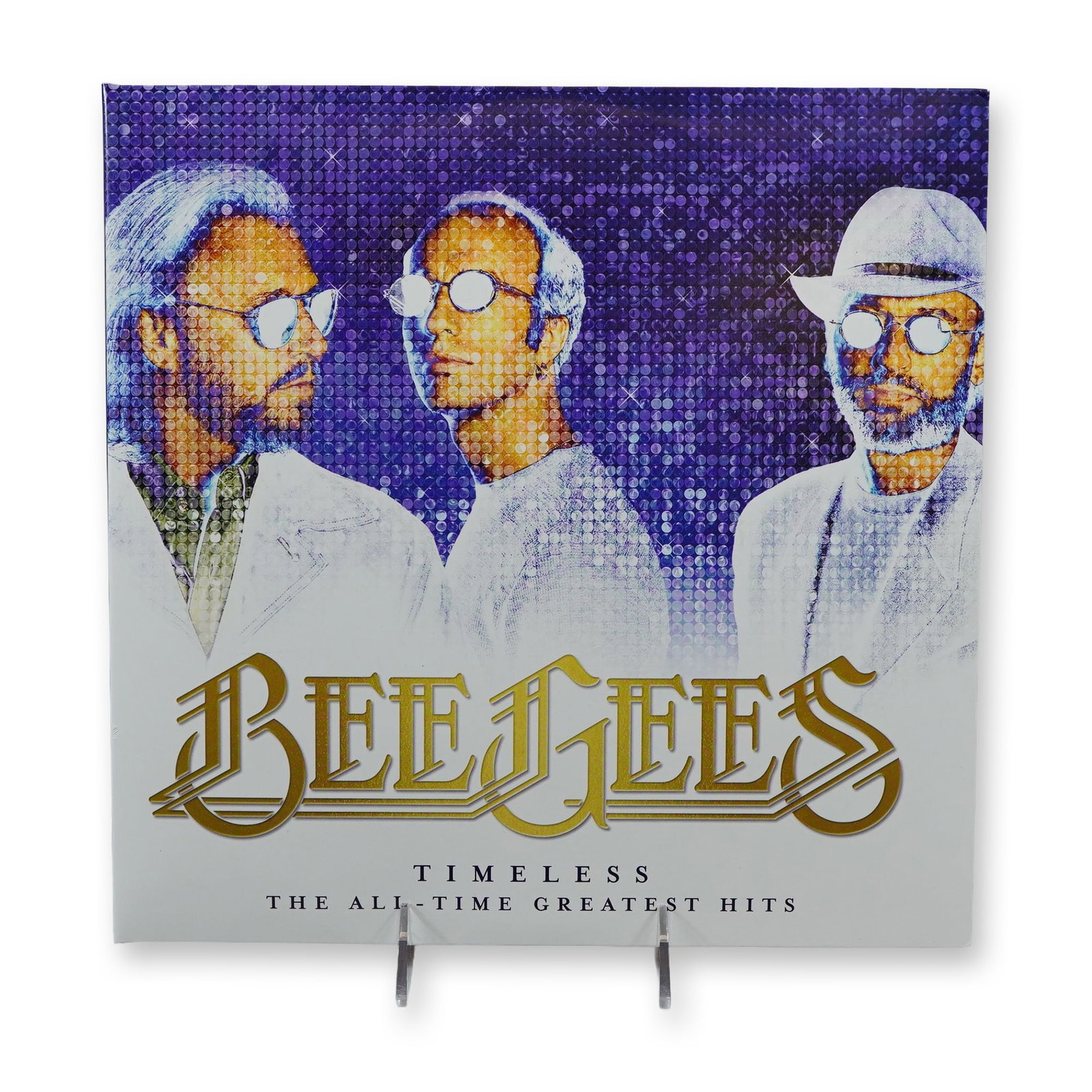 Bee Gees Timeless Greatest Hits Double Vinyl LP Records: Bee Gees. Double vinyl compilation album titled Timeless: The All-Time Greatest Hits, released by Capitol Records. The set features a gatefold jacket with a stylized mosaic-effect portrait of Barry,