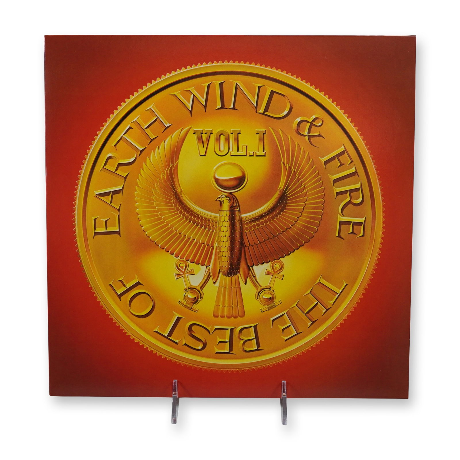 Earth, Wind & Fire The Best of Vol. 1 Vinyl LP Record: Columbia and Legacy Records reissue of the 1978 compilation album The Best of Earth, Wind & Fire Vol. 1. 12-inch vinyl LP record in a cardboard jacket featuring Egyptian-inspired gold medallion
