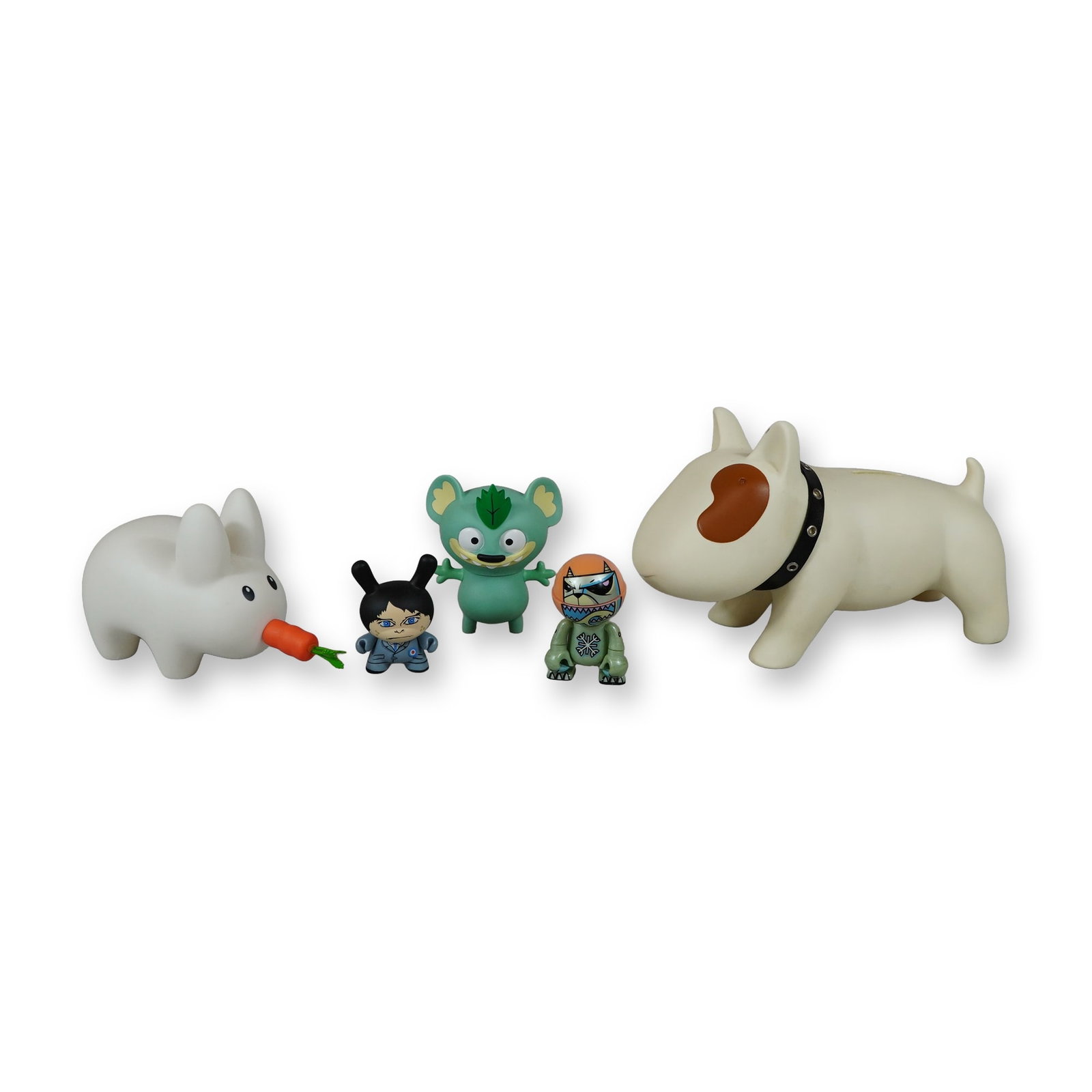 Group of Five Designer Vinyl Figures and Bank: Group of five designer vinyl art figures and a coin bank. The lot includes a Tapas Bull Terrier Doggy Doggy coin bank in white with a brown eye patch and a black studded collar, bearing an embossed Ta