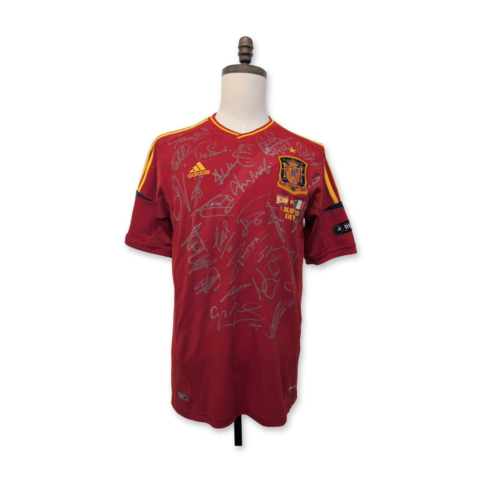 Adidas Spain National Team Signed Euro 2012 Soccer Jersey: Adidas Spain National Team commemorative home jersey, 2012. Soccer jersey in red synthetic Climacool fabric, featuring yellow shoulder stripes, the RFEF crest with single star, and a heat-pressed comm