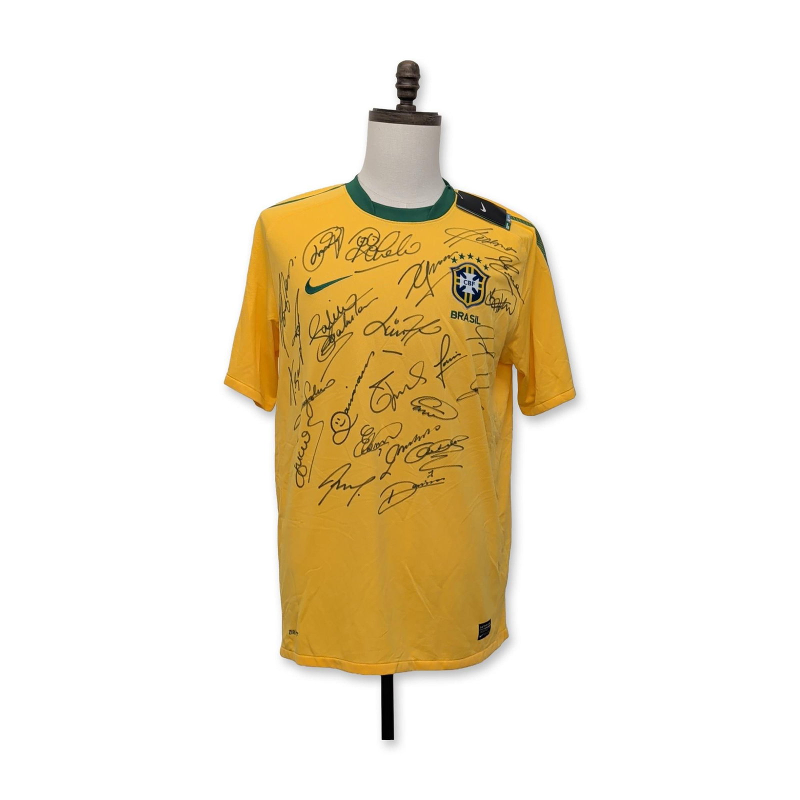 Nike Brazil 2010 World Cup Squad Signed Soccer Jersey: Nike Brazil national team home soccer jersey, 2010 FIFA World Cup squad. The yellow garment is composed of Dri-Fit polyester with rib-knit collar and side panels. Features an embroidered CBF crest and