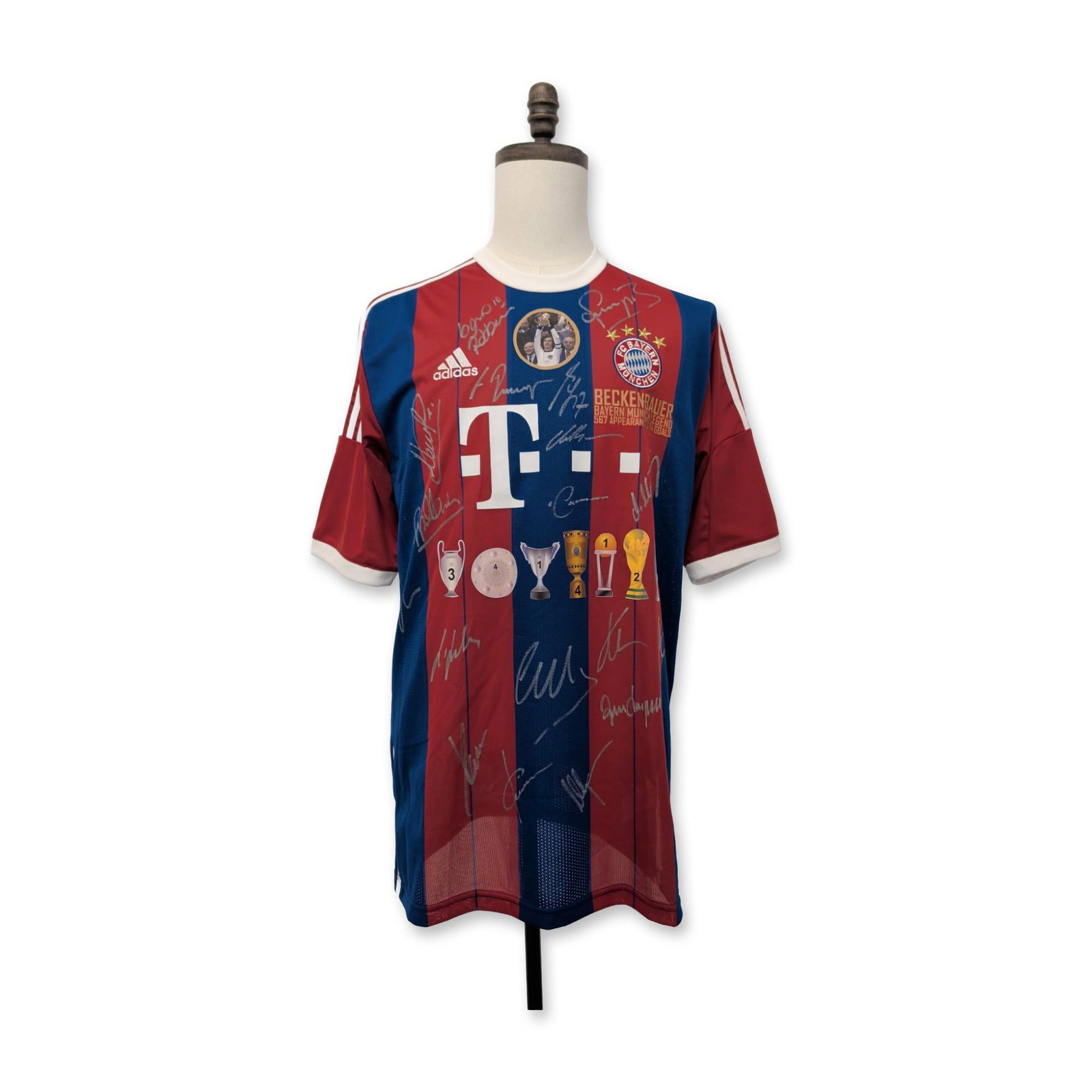 Multi-Signed FC Bayern Munich Beckenbauer Tribute Soccer Jersey: Adidas FC Bayern Munich commemorative "Beckenbauer Record Shirt" featuring red and blue vertical stripes. This limited edition tribute jersey includes gold-printed text identifying Franz Beckenbauer a