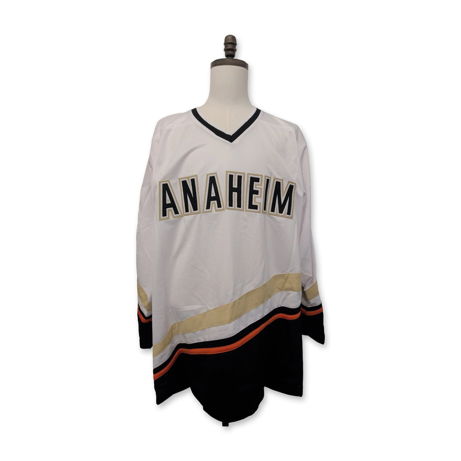 Teemu Selanne Signed Anaheim Ducks Custom NHL Hockey Jersey: Teemu Selanne signed Anaheim Ducks custom style NHL hockey jersey. White polyester construction featuring diagonal Anaheim text in black, gold, and white on the front. The reverse is finished with a w