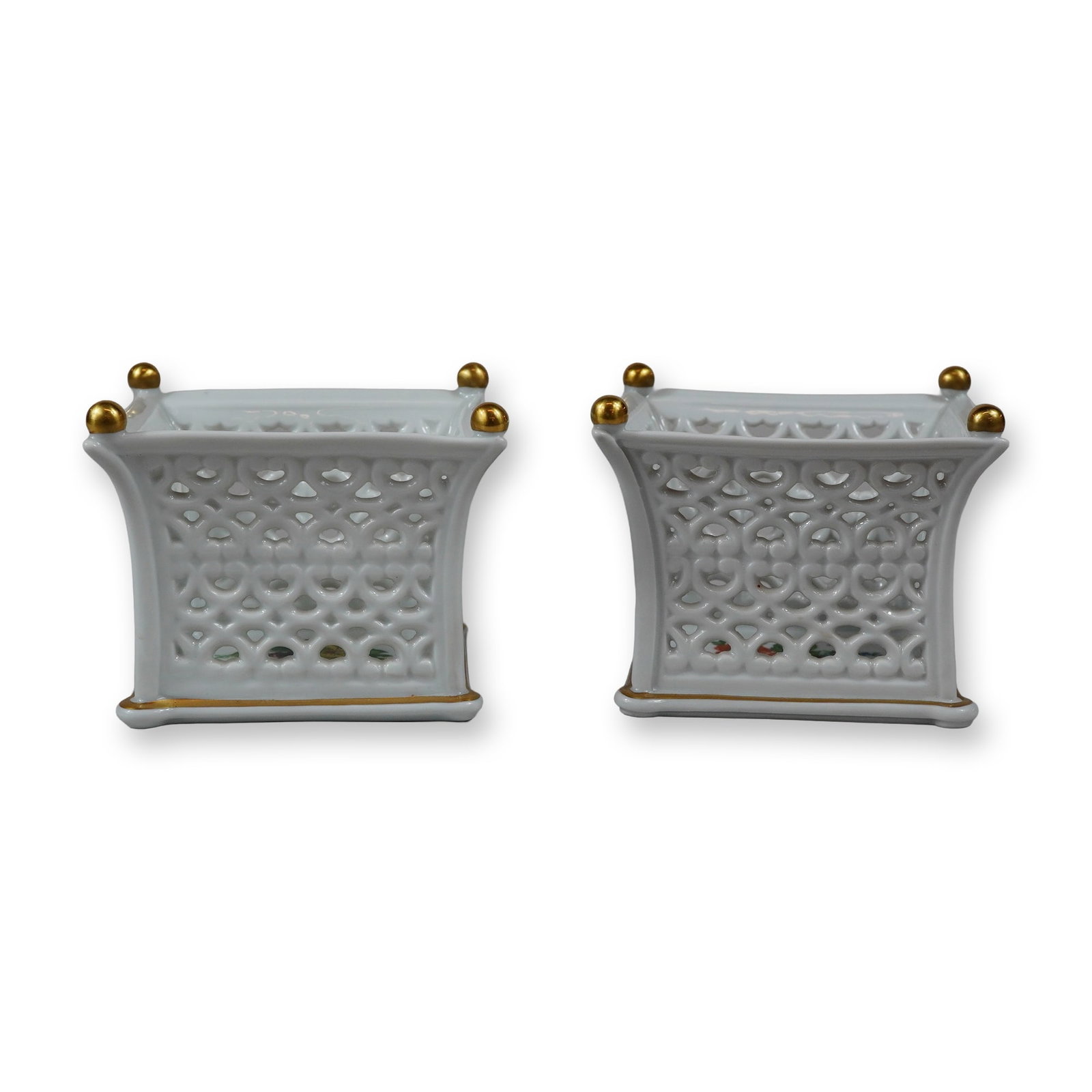 A Pair of Wallendorf Reticulated Porcelain Floral Bowls from Thuringia: This pair of square-form porcelain vessels is produced by the Wallendorf porcelain factory in Thuringia, Germany. Each piece features reticulated or openwork lattice sides decorated with a repeating