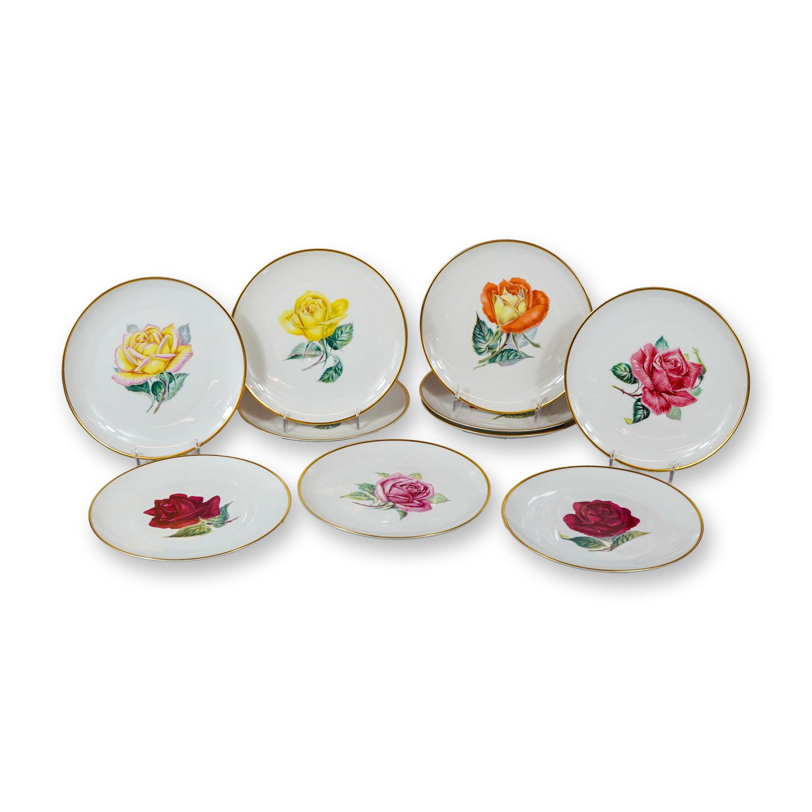 10pc Heinrich and Co. Rose Porcelain Plates: Heinrich and Co., Selb, Bavaria. Set of ten porcelain plates from the Golden Crown E7R collection, each featuring a different large-scale botanical rose motif. The transfer-printed designs include yel