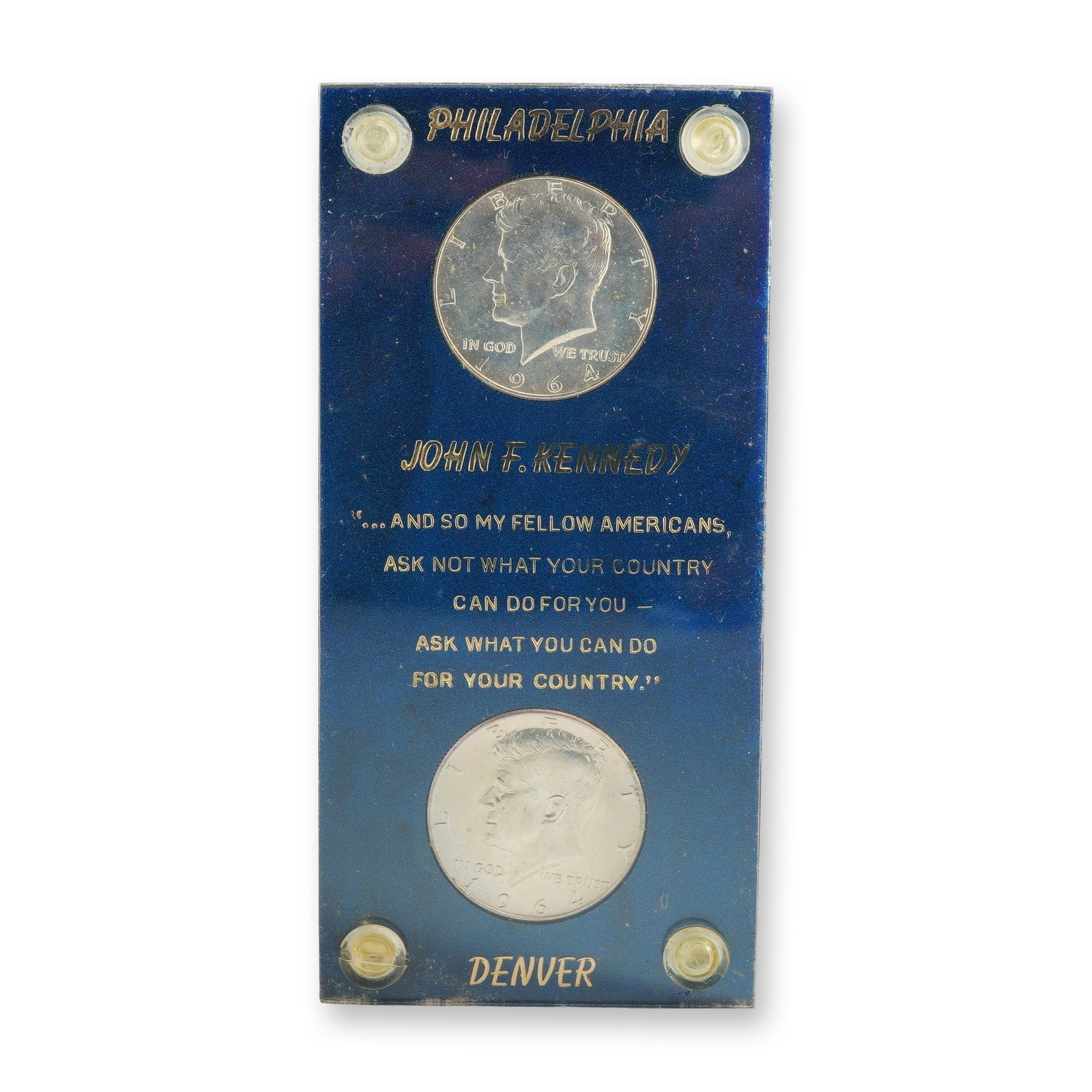 A Pair of 1964 US Kennedy Silver Half Dollars in Memorial Holder: This lot features a pair of 1964 US Kennedy silver half dollars, comprising one specimen from the Philadelphia Mint and one from the Denver Mint. These coins represent the first year of issue for the 