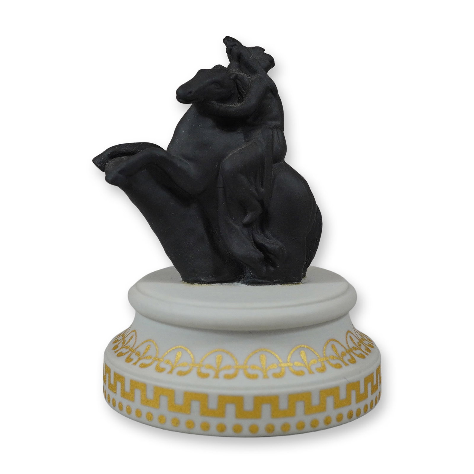 Wedgwood Black Basalt and Gilded Porcelain Boy on Horse Figurine: A Wedgwood decorative figurine featuring a youth clinging to the neck of a rearing horse. The figure is modeled in a neoclassical style and crafted from black basalt stoneware with a characteristic ma