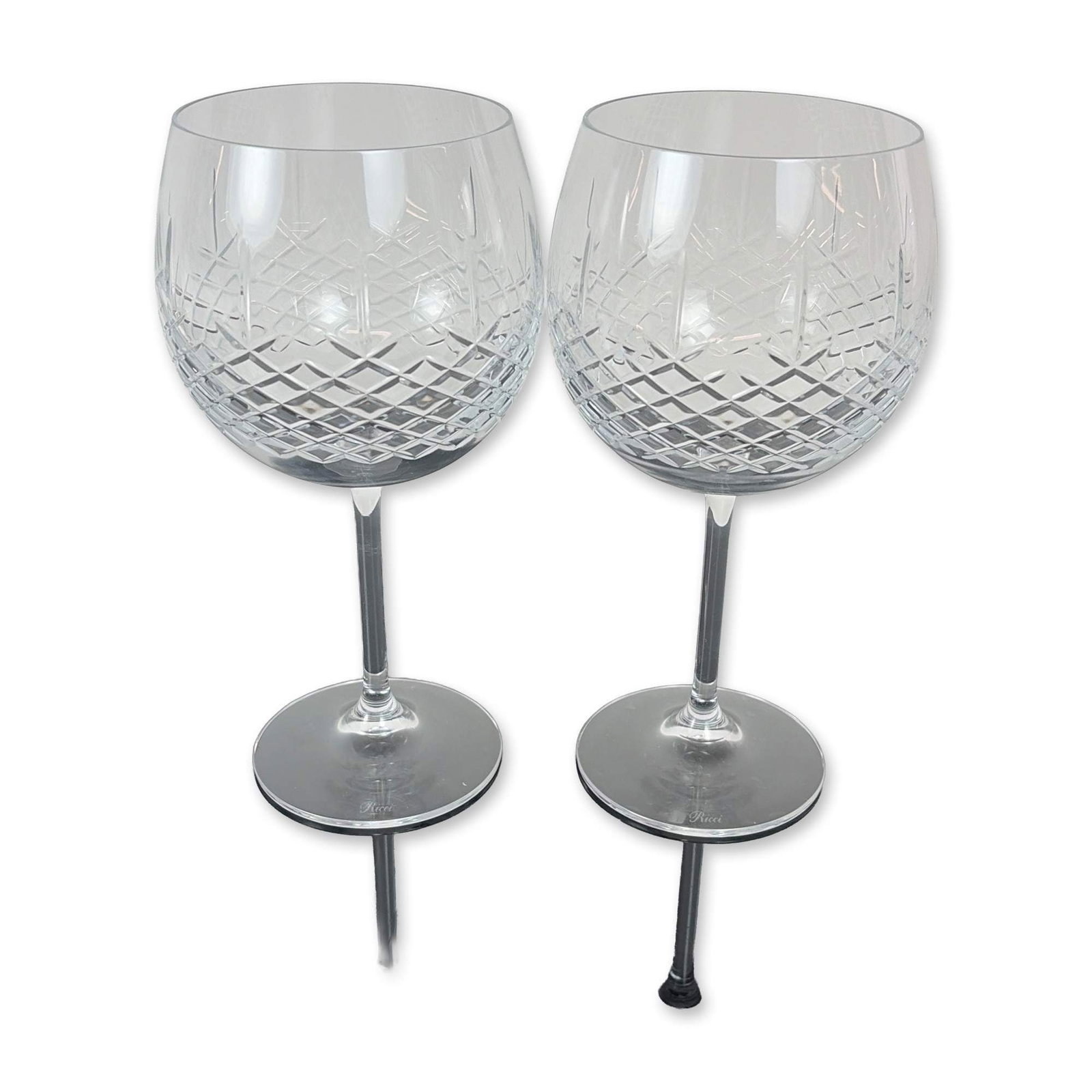 Pair of Ricci Cut Crystal Balloon Wine Glasses: Set of Ricci Argentieri cut crystal wine glasses. Each glass features a globular bowl decorated with a precision diamond cut pattern to the lower half, transitioning to a clear upper section. The