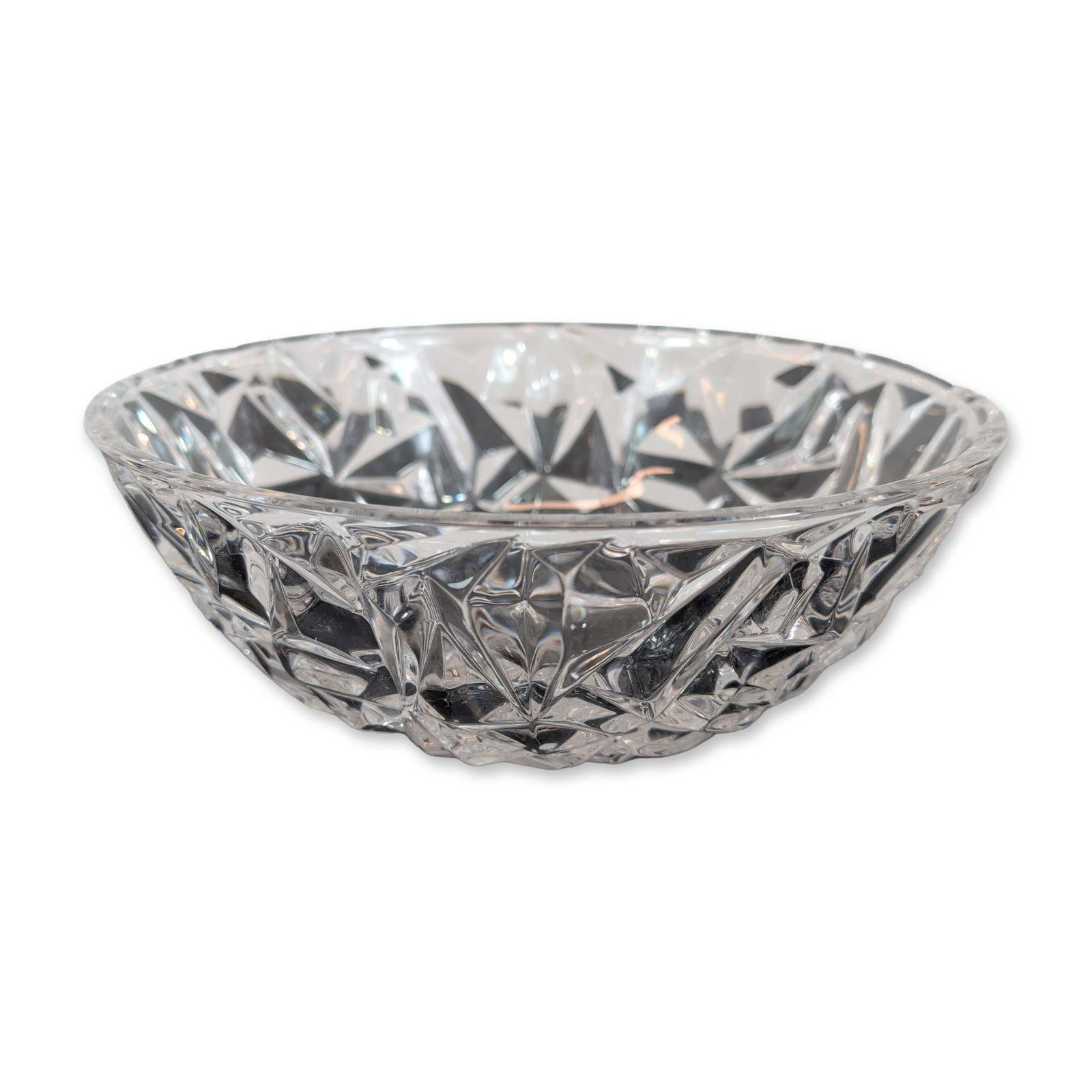 Tiffany & Co. Rock Cut Crystal Bowl: Tiffany & Co. bowl in lead crystal, in the Rock Cut pattern featuring deep geometric faceted cuts and a polished rim. Acid-etched maker mark Tiffany & Co. to the underside of the base. Dimensions: 9"d