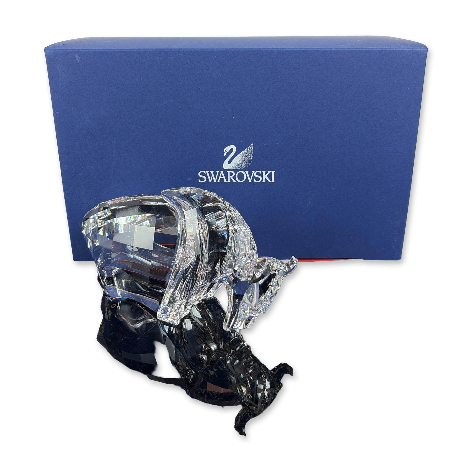 Swarovski Austrian Crystal Buffalo Figurine: Swarovski Buffalo figurine in faceted clear lead crystal from the Symbols collection. The piece depicts a standing buffalo with stylized textured facets representing the mane and tail. Etched Swarovsk