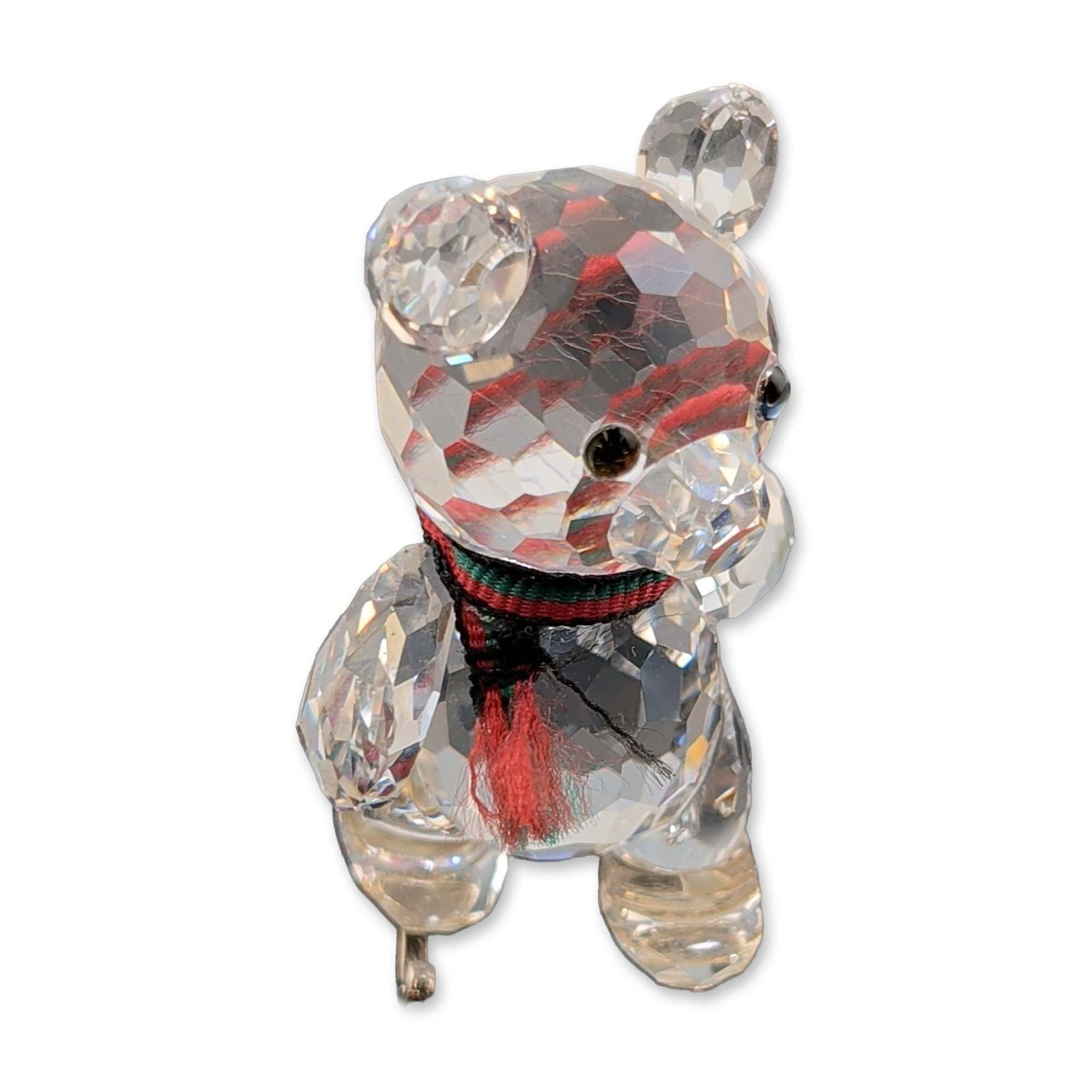 Swarovski Crystal Figurine, Kris Bear on Skates: Swarovski Kris Bear on Skates figurine from the When We Were Young series. Comprised of faceted clear lead crystal with black bead eyes and a clear faceted snout. Features include a red, green, and bl