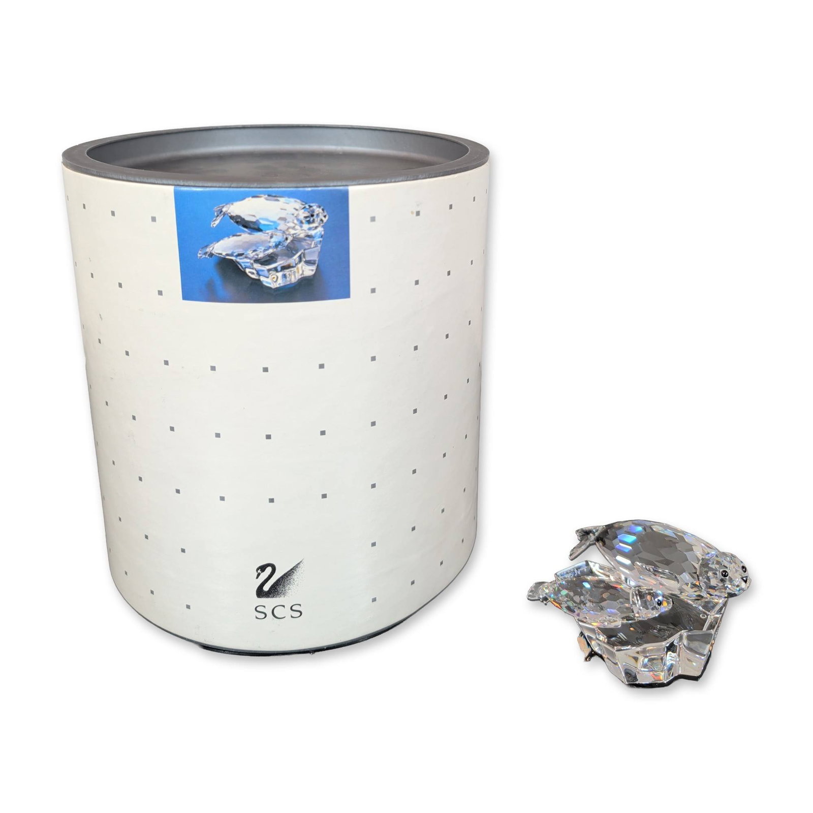 Swarovski Crystal Figurine, Save Me Seals: Swarovski (Austrian, founded 1895). 1991 Annual Edition SCS crystal figurine titled The Seals, also known as Save Me, from the Mother and Child trilogy. The piece is constructed from faceted clear lea