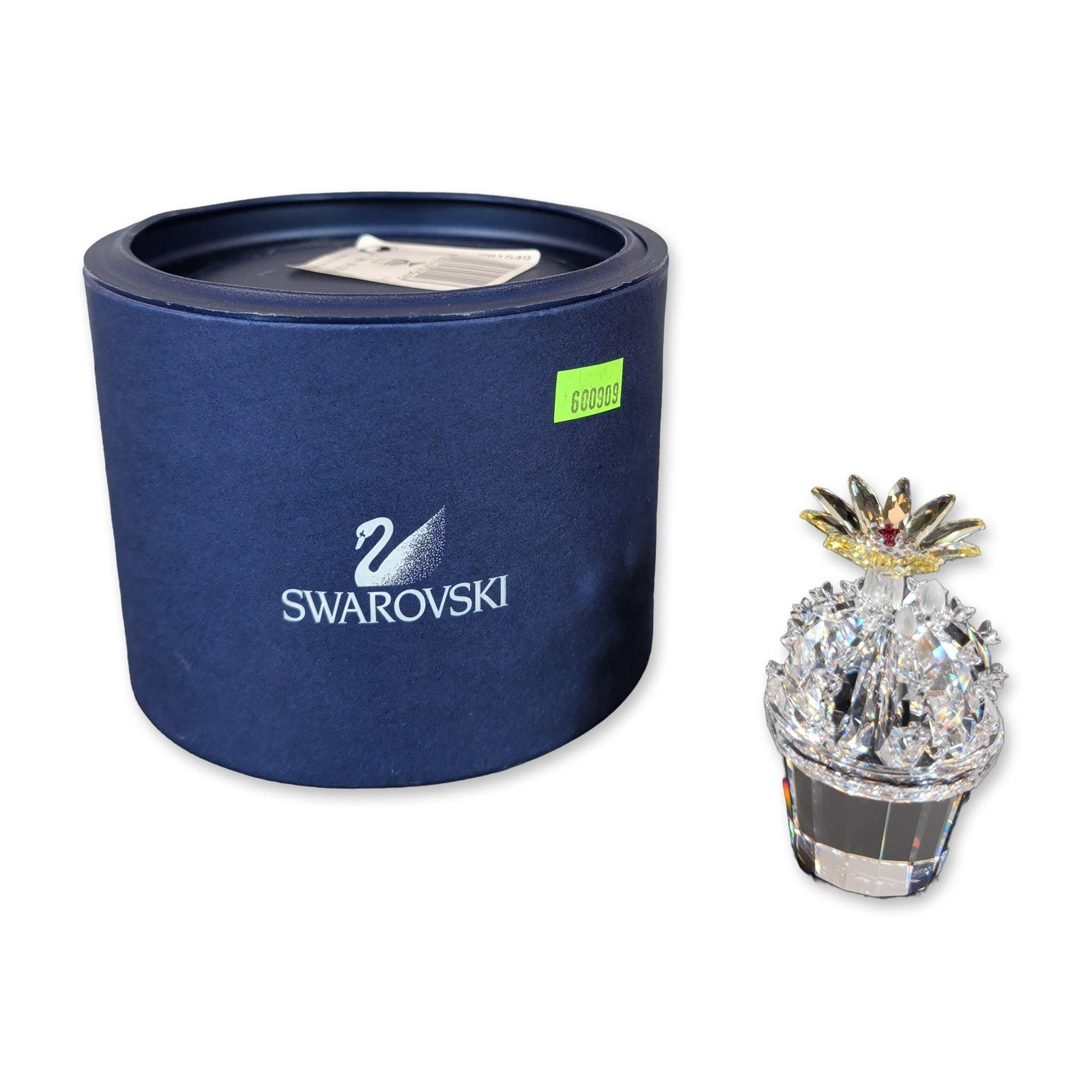 Swarovski Crystal Flowering Cactus Figurine: Swarovski figurine depicting a cactus in a pot, executed in faceted lead crystal. The design features a clear crystal pot base, a clear crystal body with numerous frosted and faceted protrusions, and 