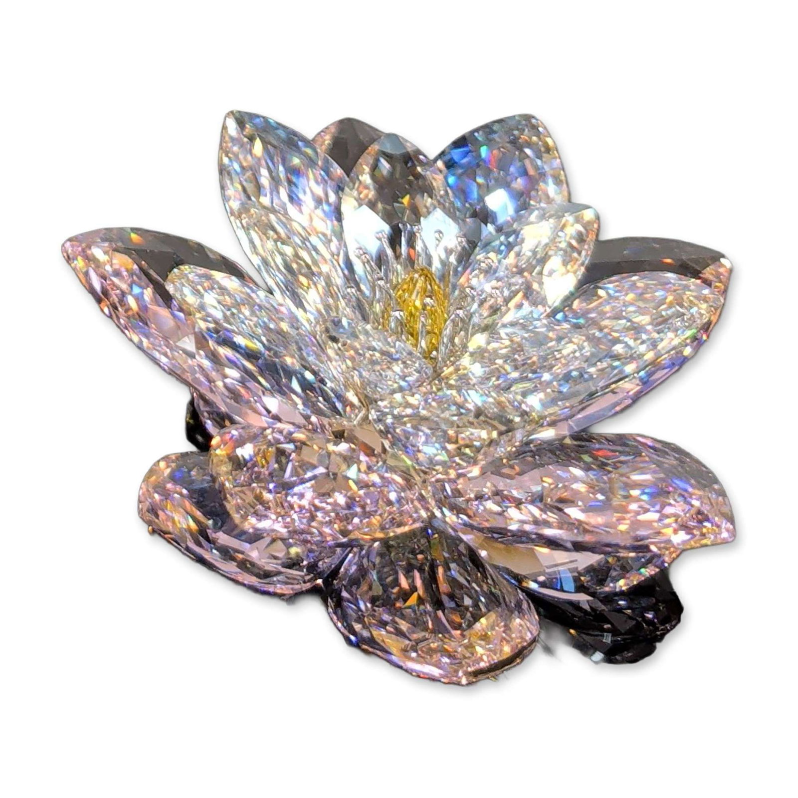 Swarovski Crystal Water Lily Rosaline Figurine: Swarovski faceted lead crystal figurine in the form of a water lily designed by Anton Hirzinger. The design comprises three tiers of clear faceted petals surrounding a central yellow faceted stamen. E