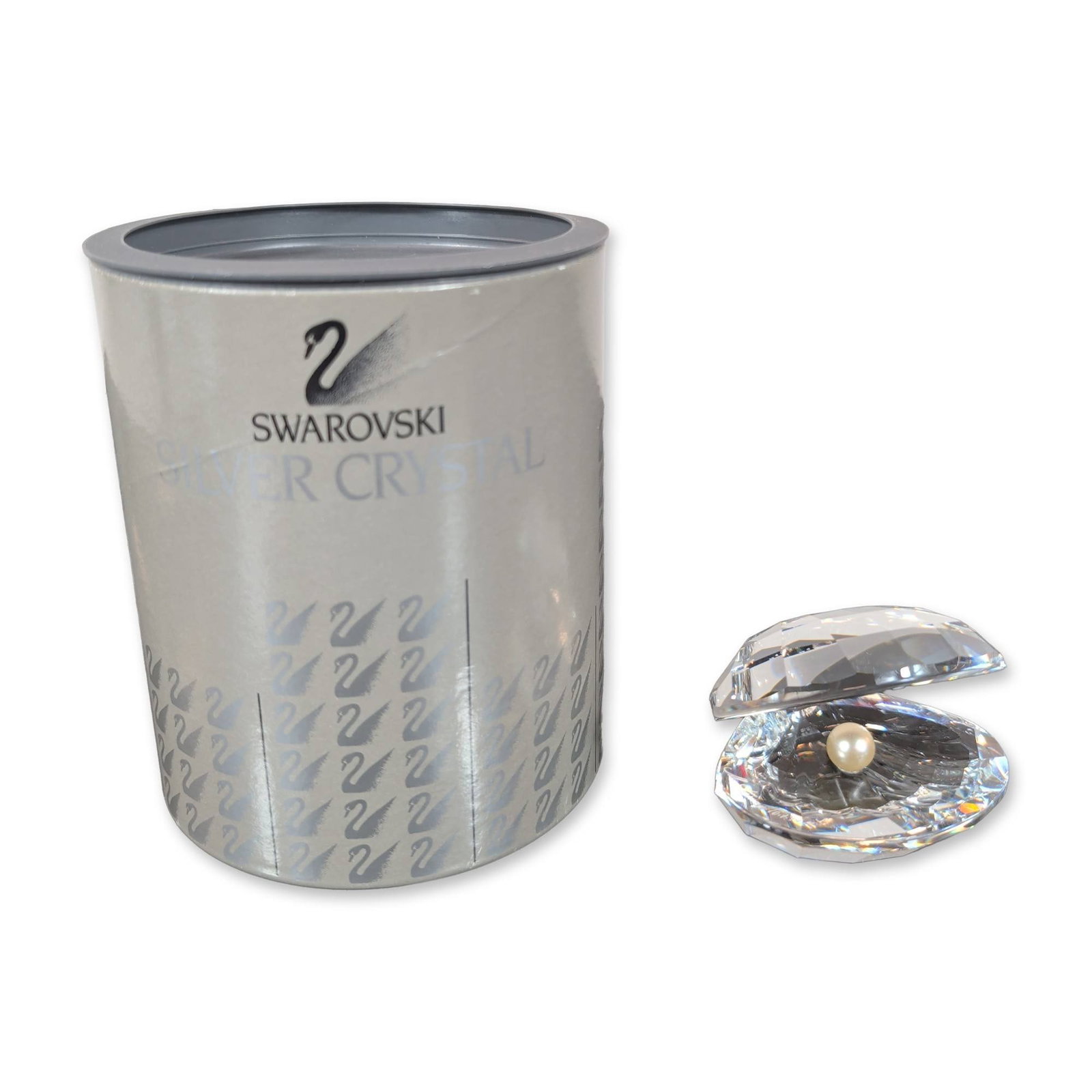 Swarovski Silver Crystal Shell with Pearl Figurine: Swarovski Silver Crystal collection Shell with Pearl figurine designed by Michael Stamey. The piece is composed of two faceted clear lead crystal valves joined at a hinge, containing a center-mounted 