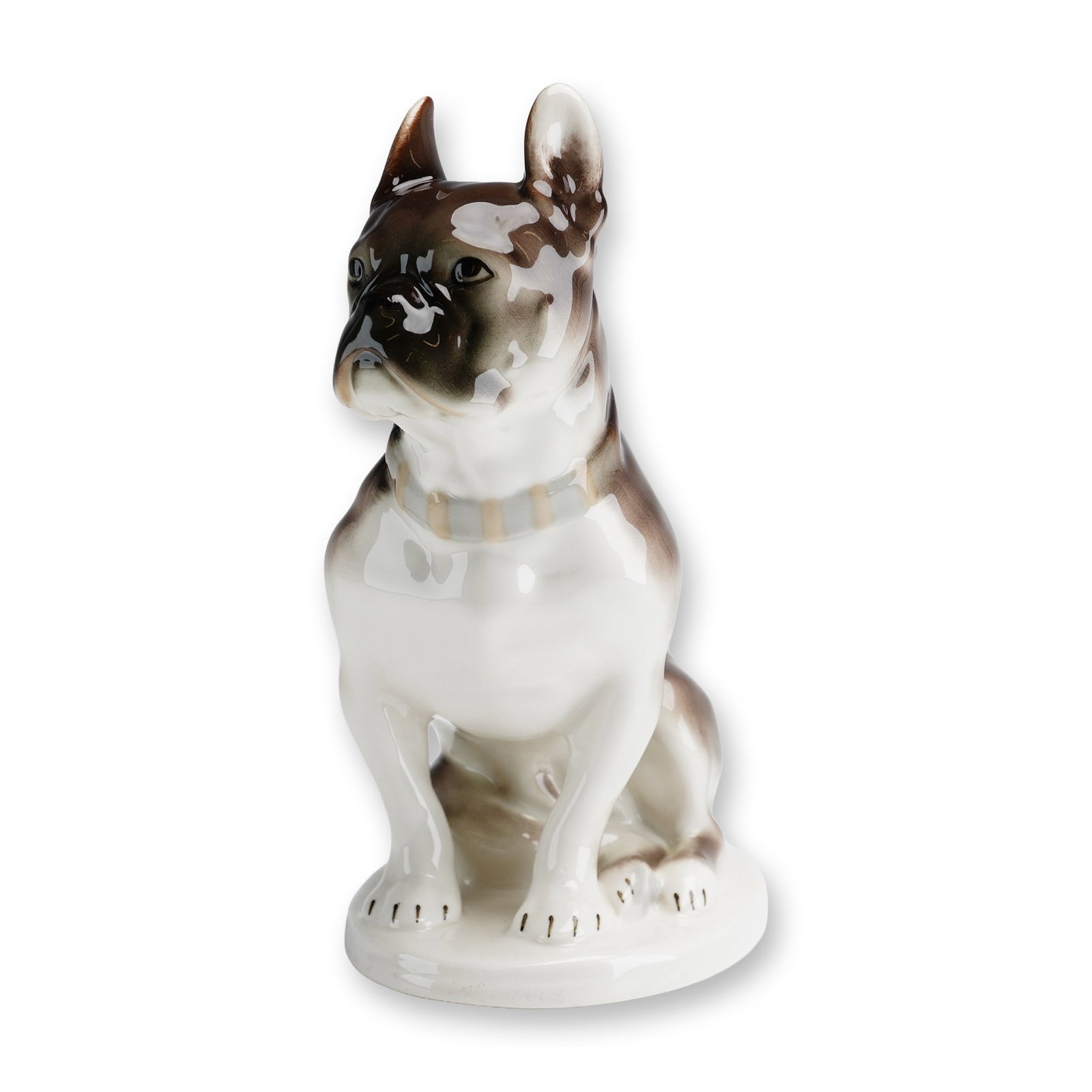 Lomonosov Russian Porcelain French Bulldog Figurine: Lomonosov Porcelain Factory, St. Petersburg. A porcelain figurine of a seated French Bulldog featuring a white ground with underglaze brown brindle patches. The dog is realistically modeled with chara