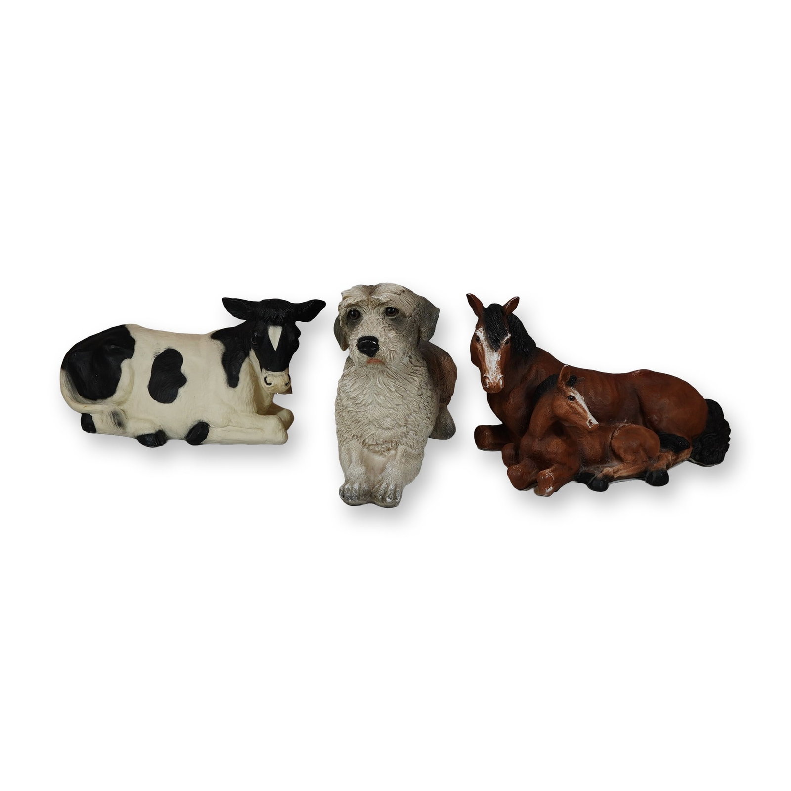 3pc Universal Statuary Corp. Animal Composite Figurines: Universal Statuary Corp. group of three vintage animal figurines, cast in hand-painted composition resin with textured finishes. The collection includes a recumbent Holstein cow, a seated shaggy terri
