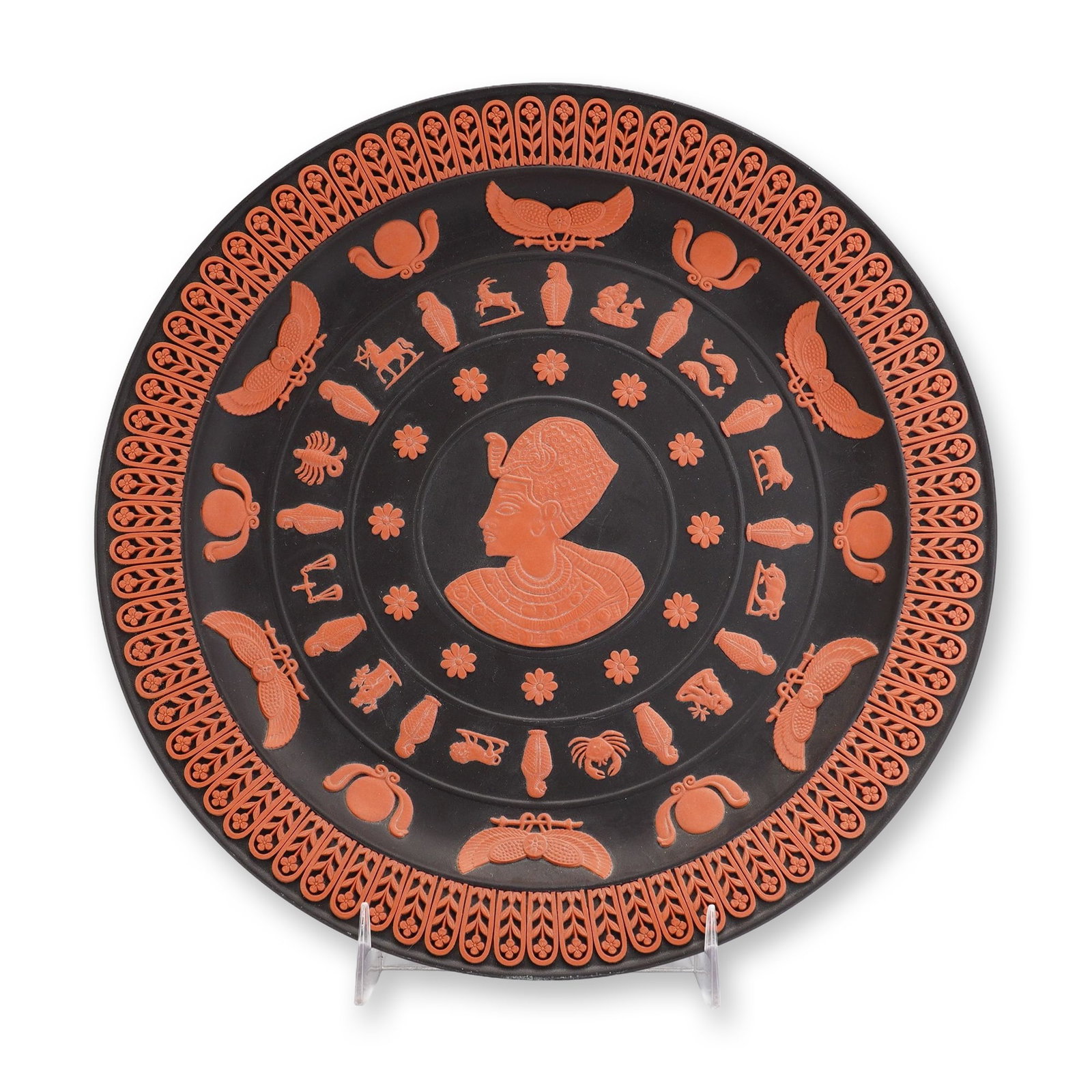 Wedgwood Egyptian Collection Tutankhamun Limited Edition Black Basalt and Terracotta Plate: This decorative plate from the Wedgwood Egyptian Collection features a profile portrait of King Tutankhamun in terracotta (rosso antico) relief. The plate is constructed from matte black basalt stonew