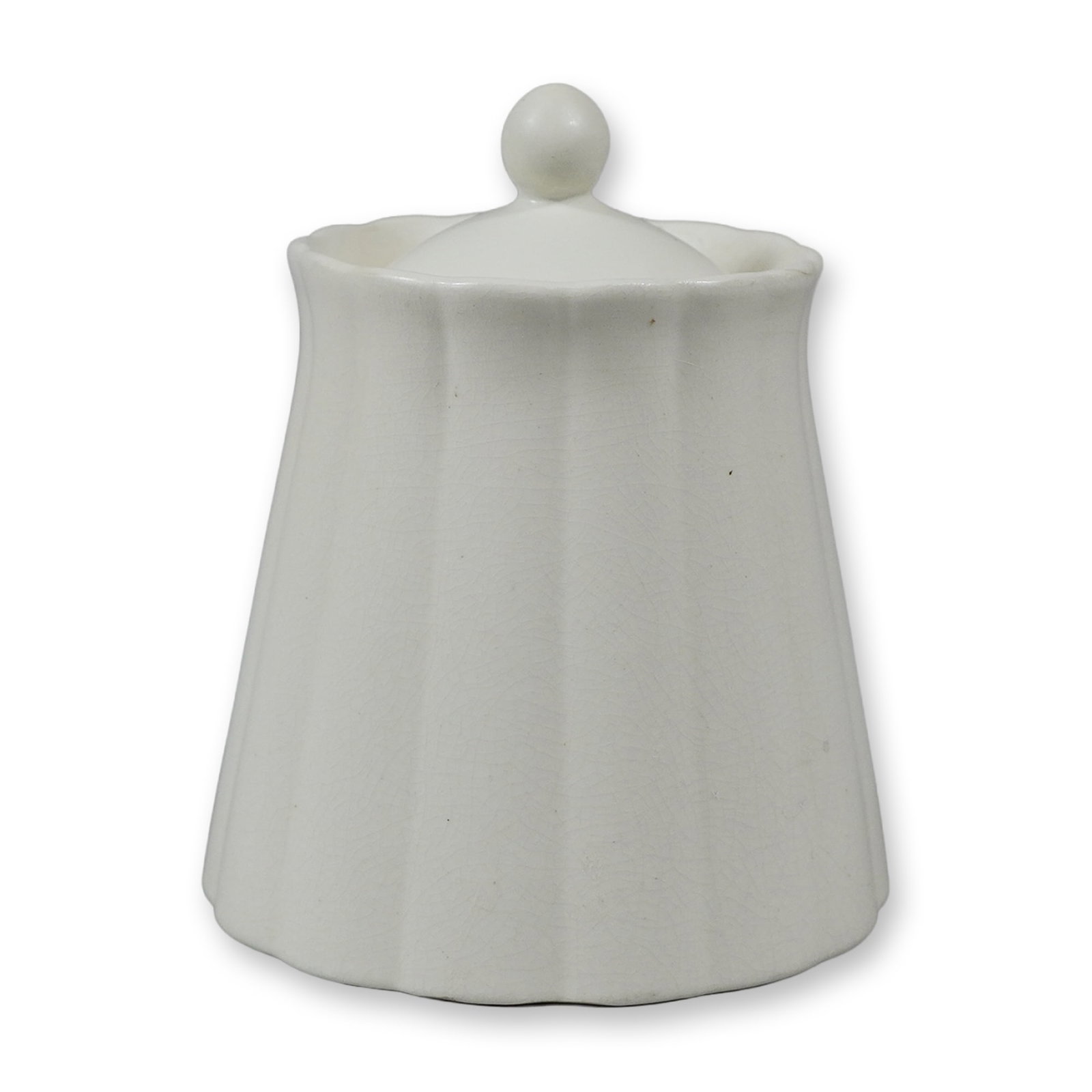 Wedgwood by Keith Murray Fluted White Glazed Lidded Salt Cellar: The vessel features a tapered body with vertical fluting that creates a scalloped edge at the flared rim and the base. It is topped with a conforming lid finished with a simple spherical knob finial. 