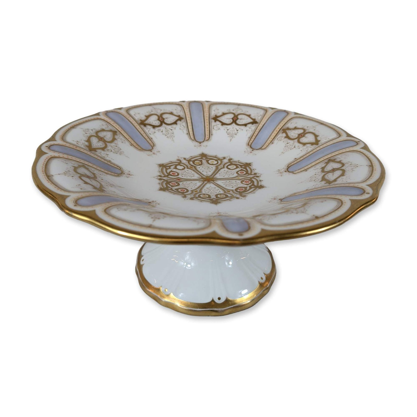 Carl Tielsch & Co. German Gilt Porcelain Footed Compote: Late 19th-century porcelain footed compote featuring a shallow bowl with a scalloped rim. The interior is decorated with a radial pattern of light blue enameled lappets and gilded heart-shaped foliate