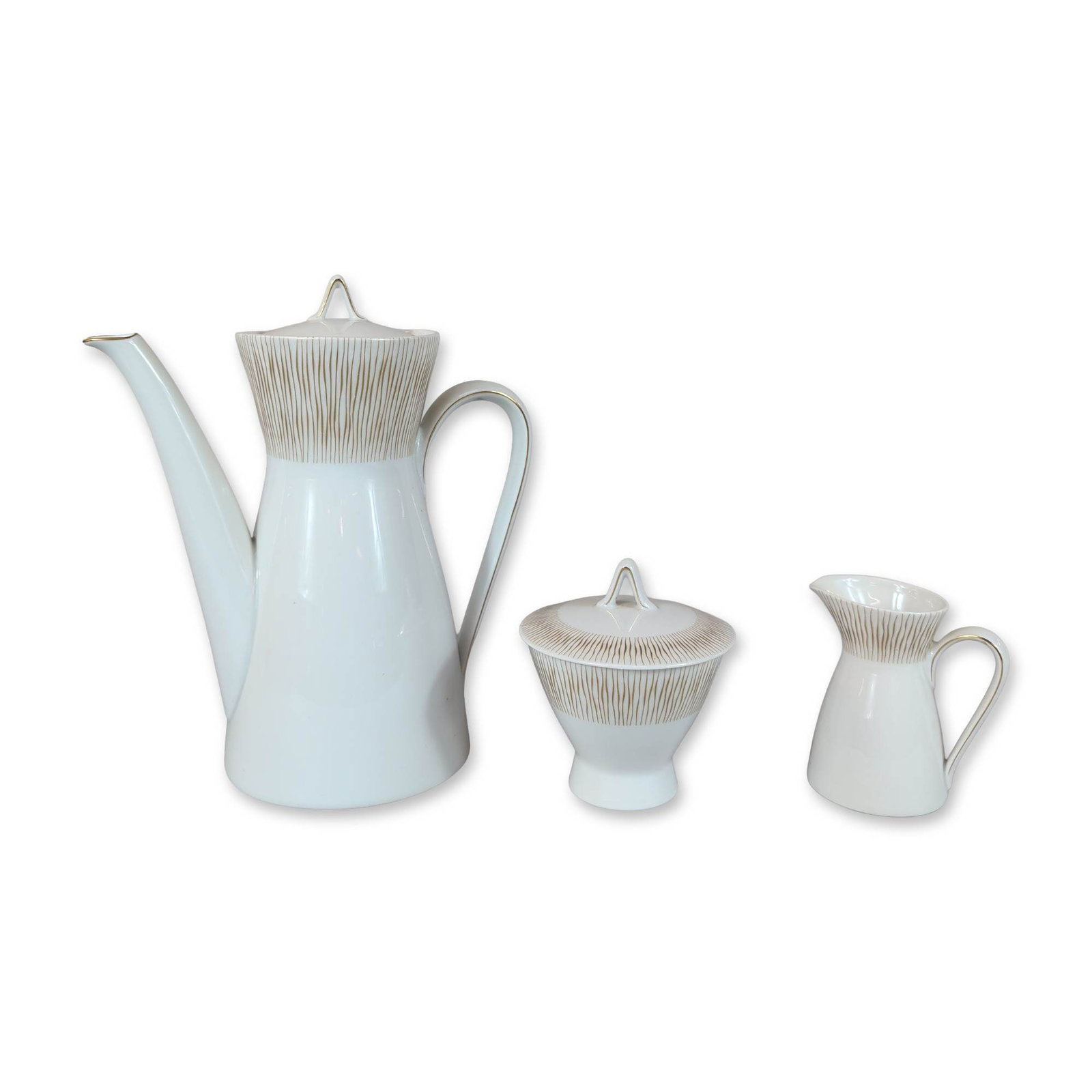 5pc Rosenthal Mid-Century Modern Goldstrahlen Porcelain Coffee Set: Rosenthal, Selb, Germany. Trio of Mid-Century Modern coffee service pieces in white glazed porcelain, comprising a tall lidded coffee pot, a double-handled lidded sugar bowl, and a creamer. The set