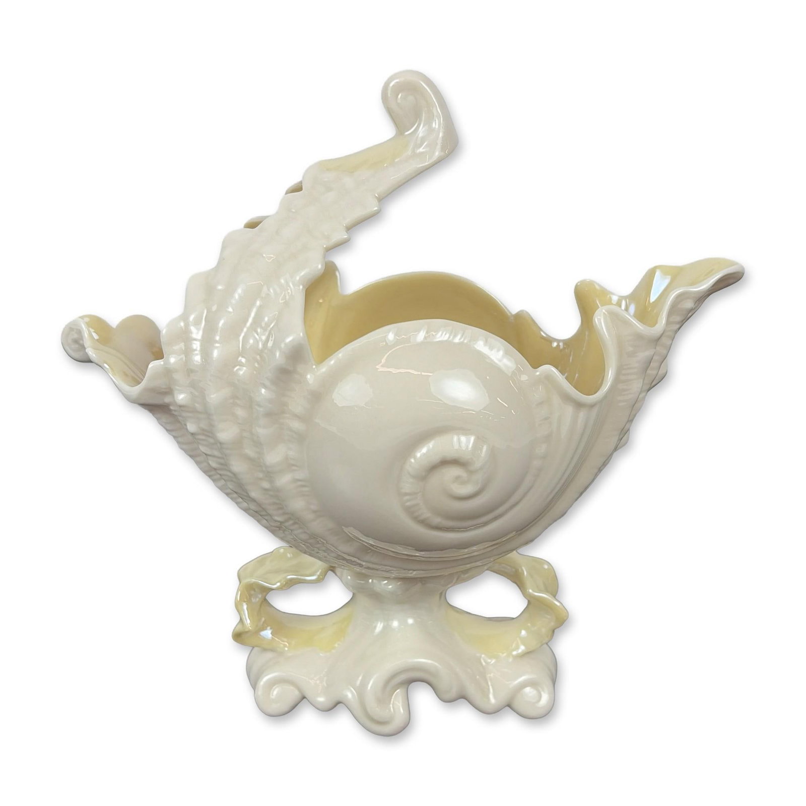 Belleek Ireland Victoria Nautilus Parian Porcelain Shell Vase: Belleek Pottery Victoria Nautilus centerpiece in fine Parian porcelain, featuring a large nautilus shell form set upon an ornate, scrolling pedestal base. The vessel is finished with a pearlescent