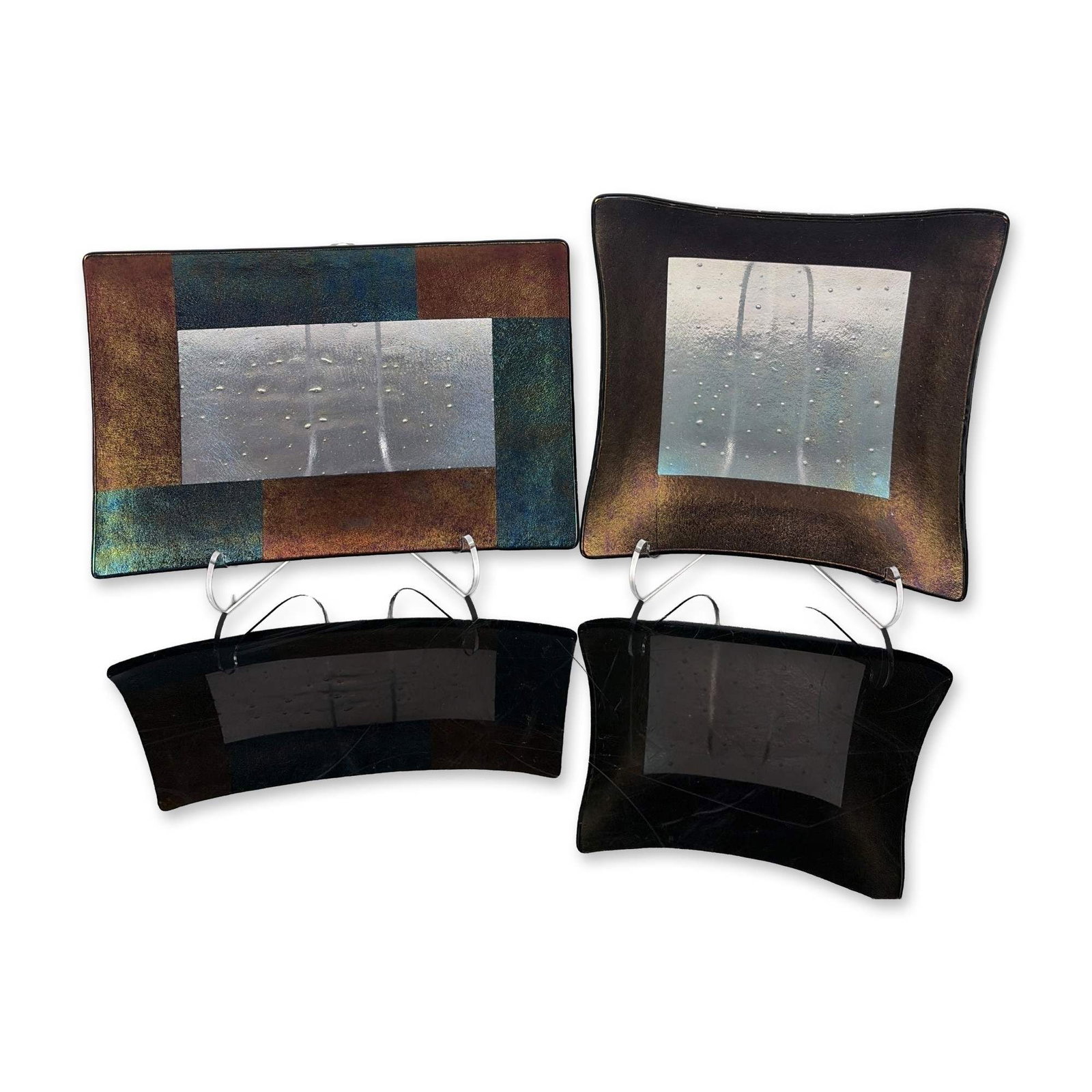 2pc Kurt McVay Fused Dichroic Art Glass Dishes: Pair of Kurt McVay contemporary studio art glass dishes in kiln-fused and slumped glass. Each vessel features a central silver-toned panel with controlled bubble inclusions and textured linear