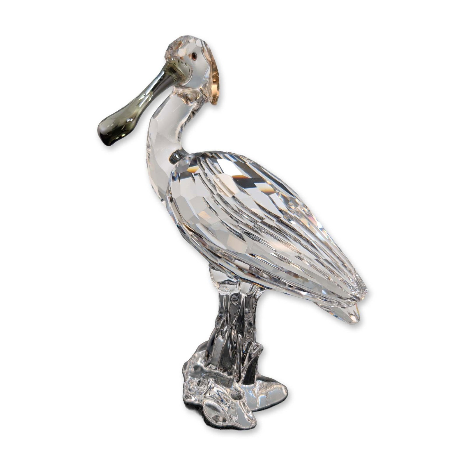 Swarovski Crystal Feathered Beauties Figurine, Spoonbill: Swarovski Spoonbill figurine from the Feathered Beauties collection. The bird is crafted in faceted clear lead crystal with a black tinted beak and amber-brown tinted head crest, mounted on a textured