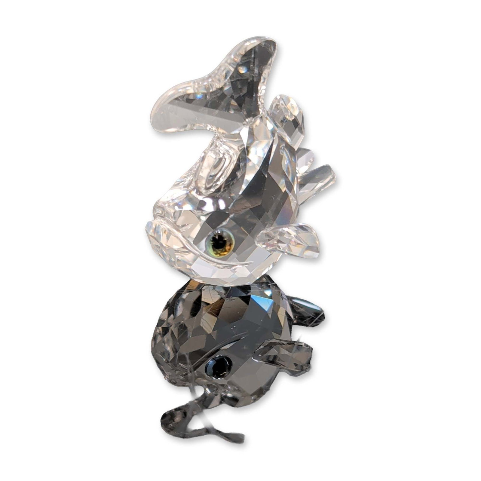 Swarovski Silver Crystal Baby Carp Figurine: Swarovski Silver Crystal baby carp figurine. The faceted clear lead crystal piece features a bulbous body with a fanned tail and prominent protruding eyes with dark centers. Features an etched Swarovs