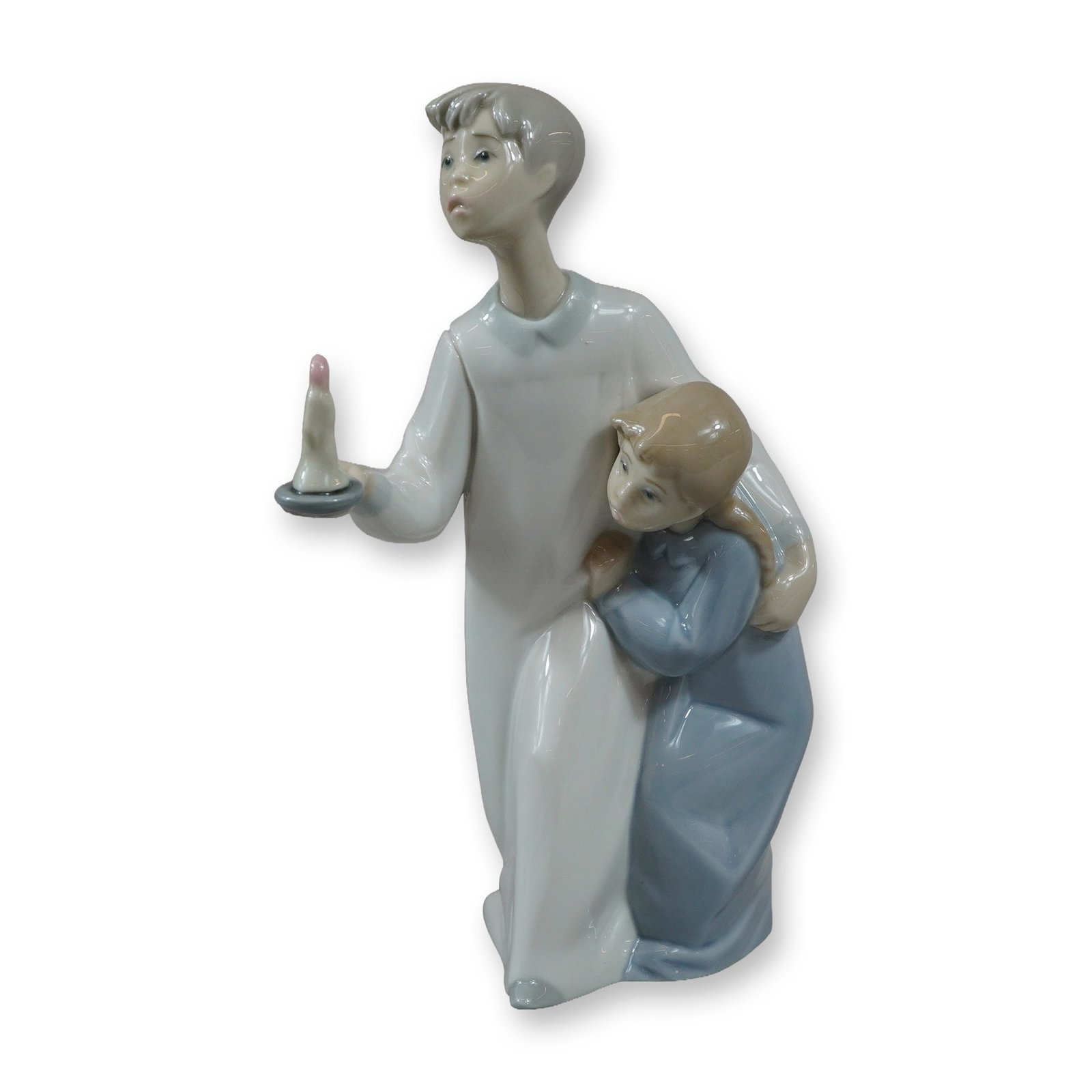 Lladro Glazed Porcelain Figurine 4874 Boy and Girl with Candle: Lladro glazed porcelain figurine, model number 4874, often titled Nightly Comfort or Boy and Girl with Candle. The piece depicts a young boy in a long white nightgown holding a single candle in a hold