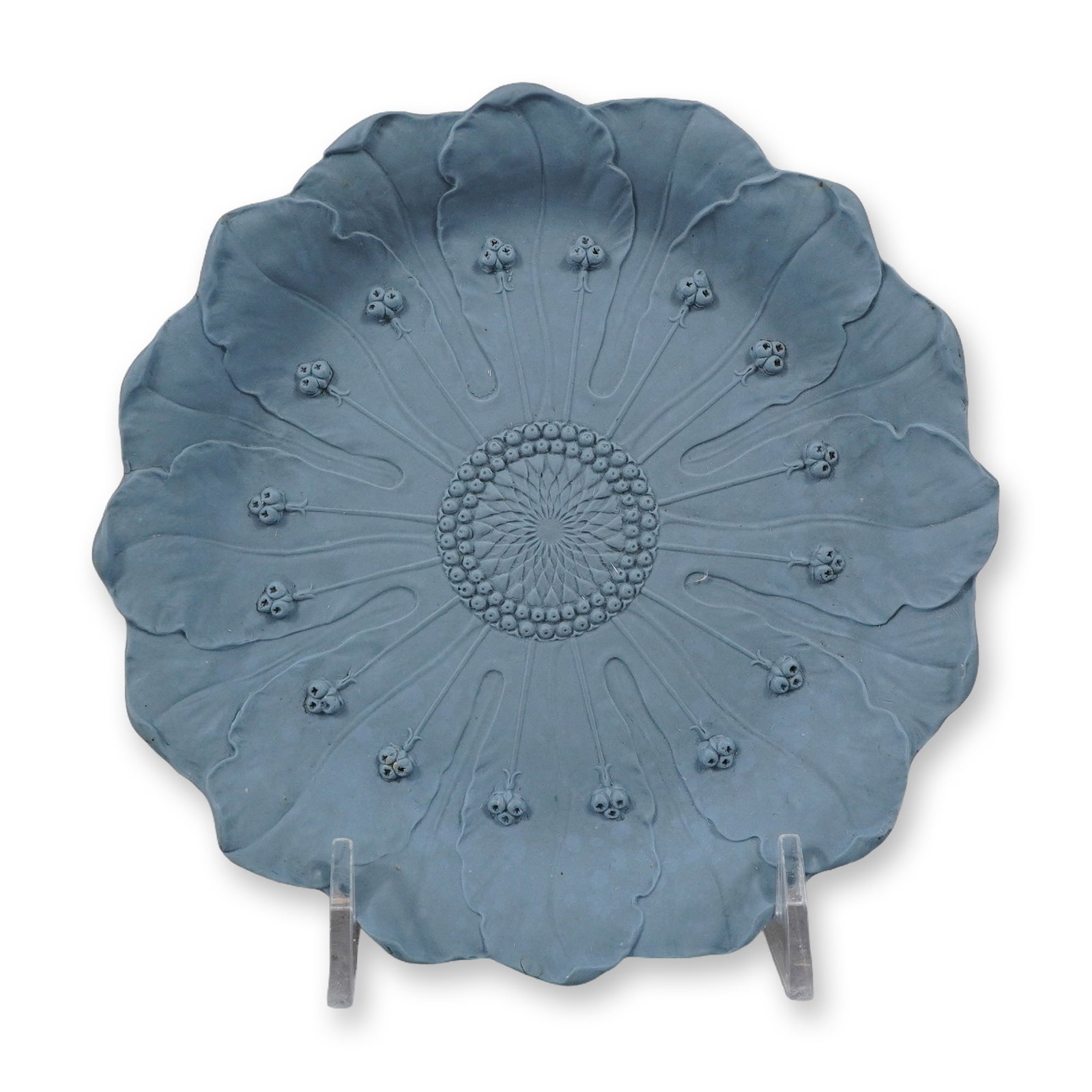 Wedgwood Blue Jasperware Floral Form Dish: This shallow dish is crafted from fine-grained, unglazed blue stoneware known as Jasperware, a signature material of the Wedgwood factory. The piece is designed in an organic floral form with a lobed 