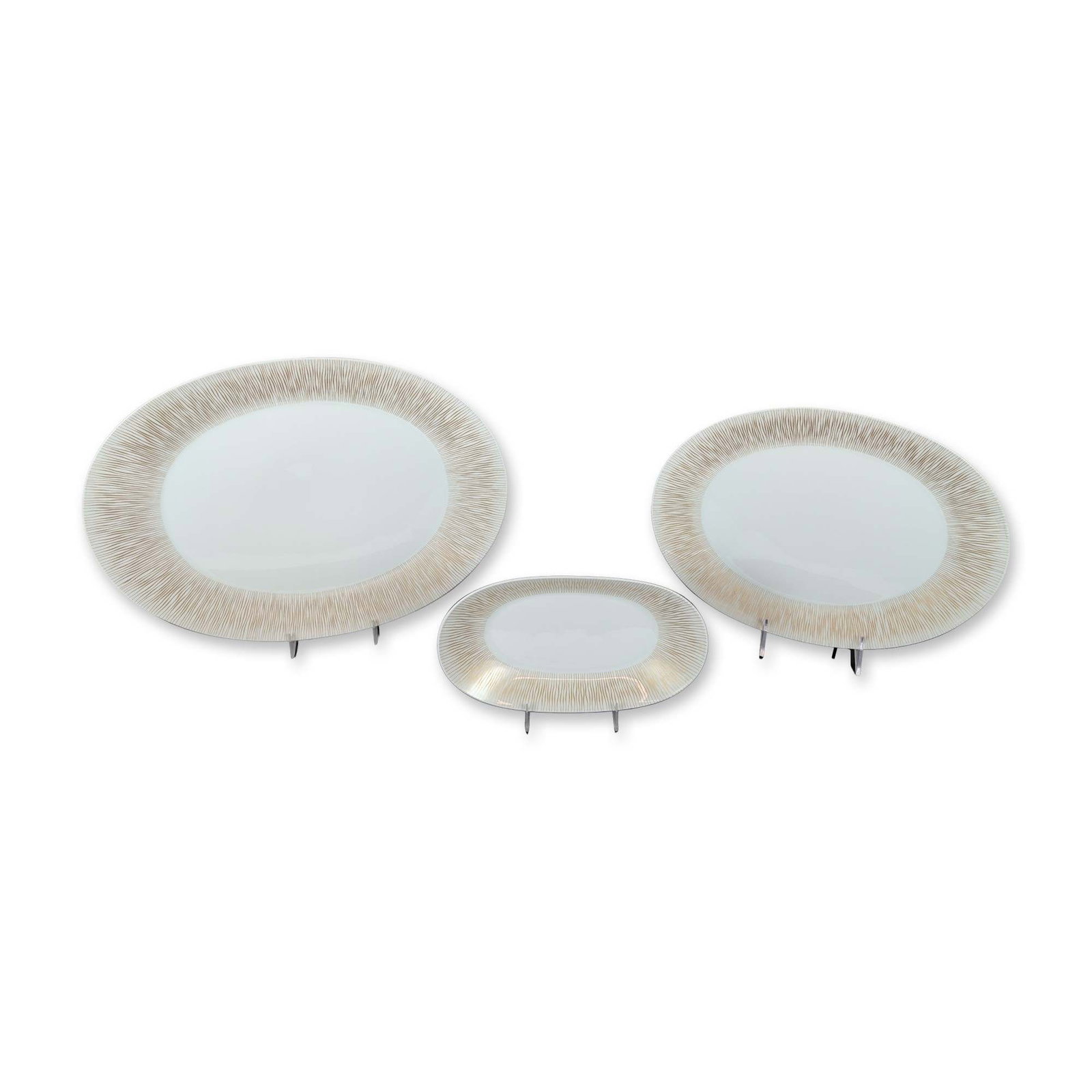 7pc Rosenthal Goldstrahlen Porcelain Serving Dishes: 7pc Rosenthal graduated oval serving platters, lidded serving bowl, salad bowl, and gravy boat with attached under plate in the Goldstrahlen pattern, crafted in fine white porcelain. Each piece featur