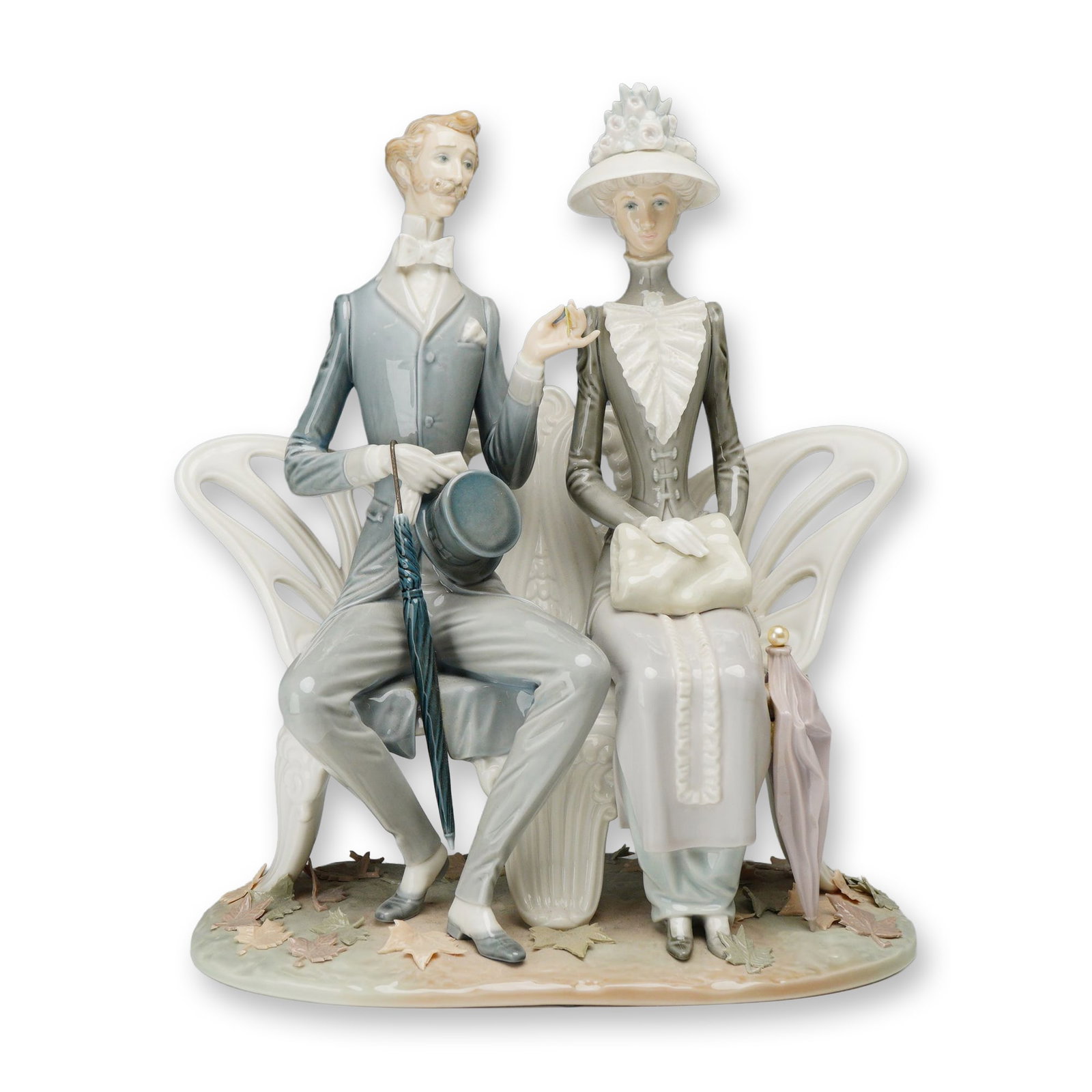 Lladro Spanish Porcelain Lovers in the Park, 1274: Lladro (Spanish, 20th century). Lovers in the Park porcelain figural group, model 1274, designed by Antonio Ballester. Hand-painted glazed porcelain figurine depicting an Edwardian-style couple seated