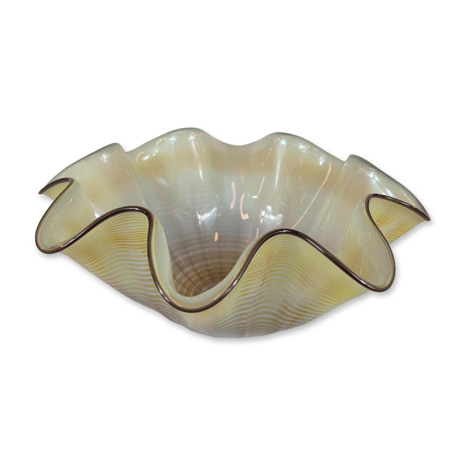 Art Studio Glass Citron Seaform Glass Sculpture: Sculpture in hand-blown glass, featuring a ruffled citron-colored body decorated with fine white concentric threadwork. The vessel is finished with a dark glass lip wrap. The base features a polished 
