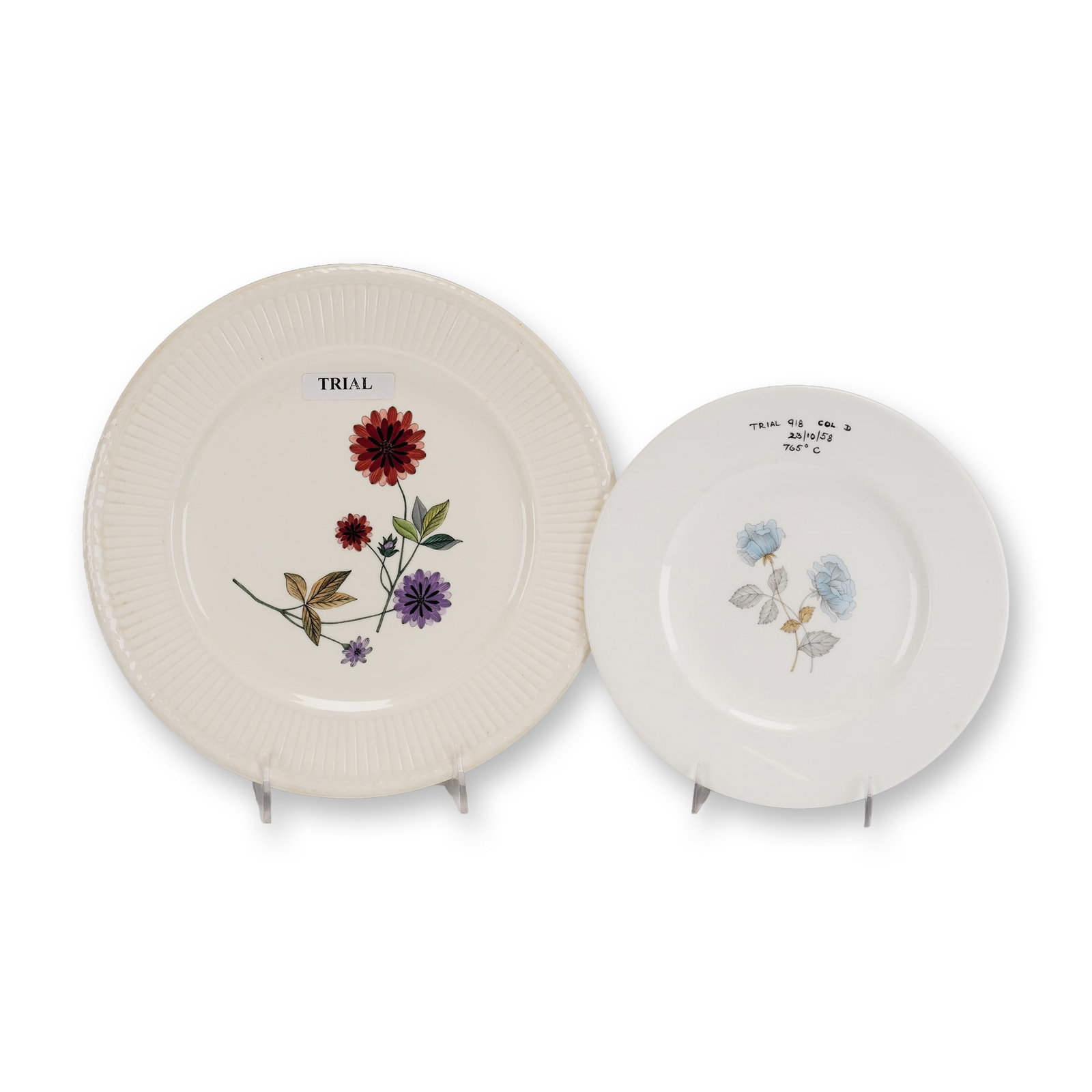 2pc Wedgwood Ceramic Floral Trial Plates: This lot consists of two Wedgwood ceramic plates used as factory trial pieces for testing patterns and firing processes. The first item is a Wedgwood Queens Ware earthenware plate in the Edme shape, c