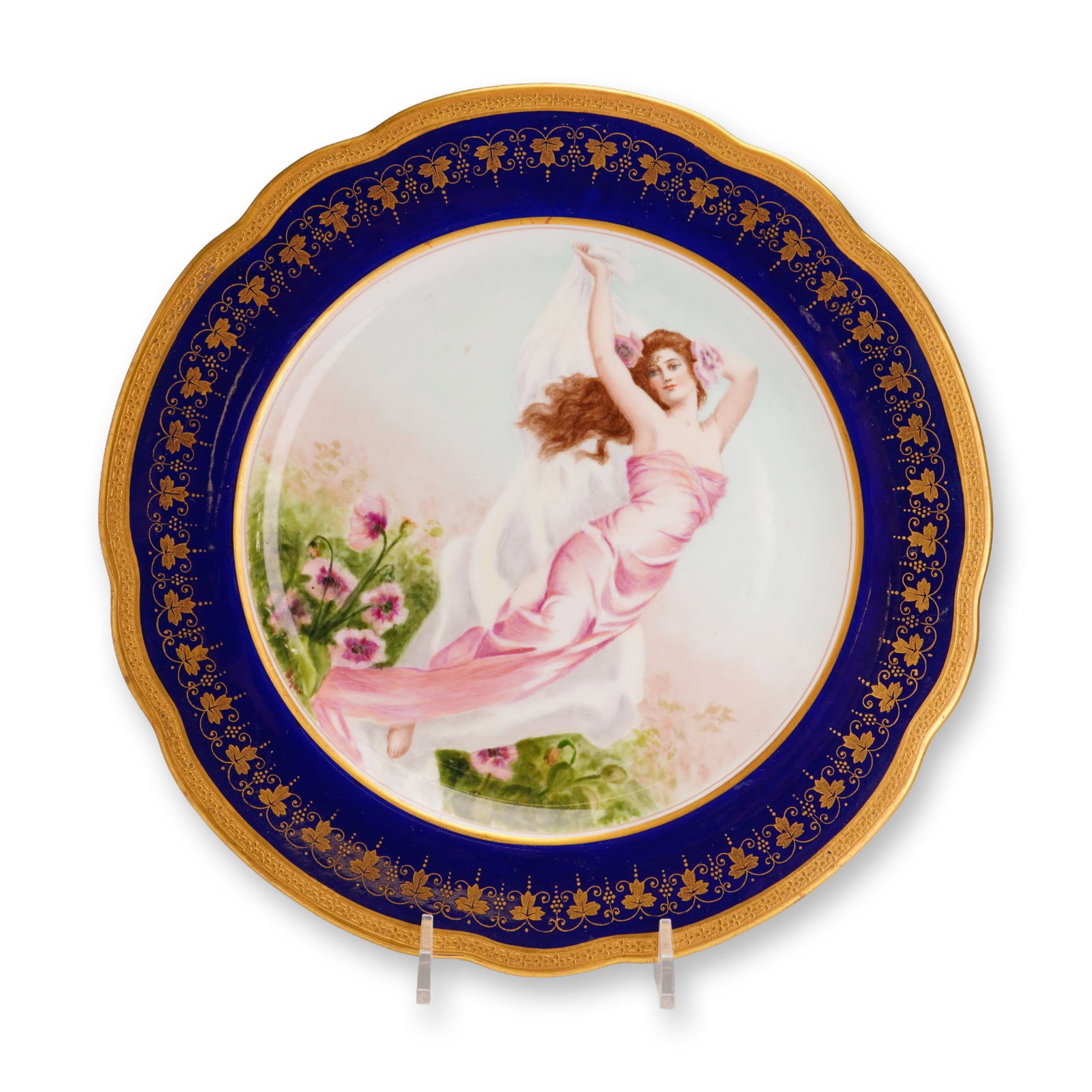 Wedgwood The Awakening of Summer Hand Painted Porcelain Cabinet Plate circa 1910: A circular porcelain cabinet plate manufactured by Wedgwood at the Etruria works in Staffordshire, England. The central reserve features a hand-painted allegorical scene titled The Awakening of Summer