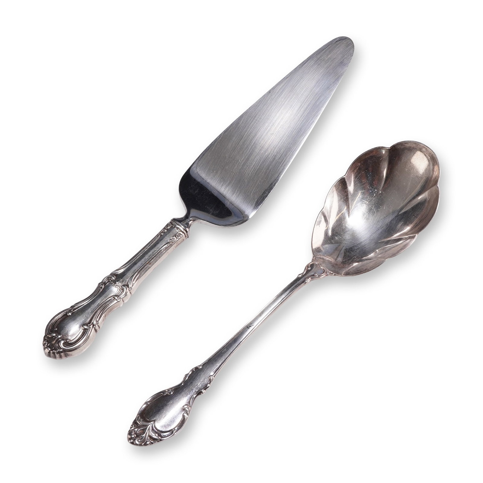 2pc Holmes and Edwards Silver Fashion Serving Set: A two-piece Holmes and Edwards silver serving set in the Silver Fashion pattern, consisting of a berry serving spoon and a cake server. The serving spoon features an ornate handle with scrollwork and 