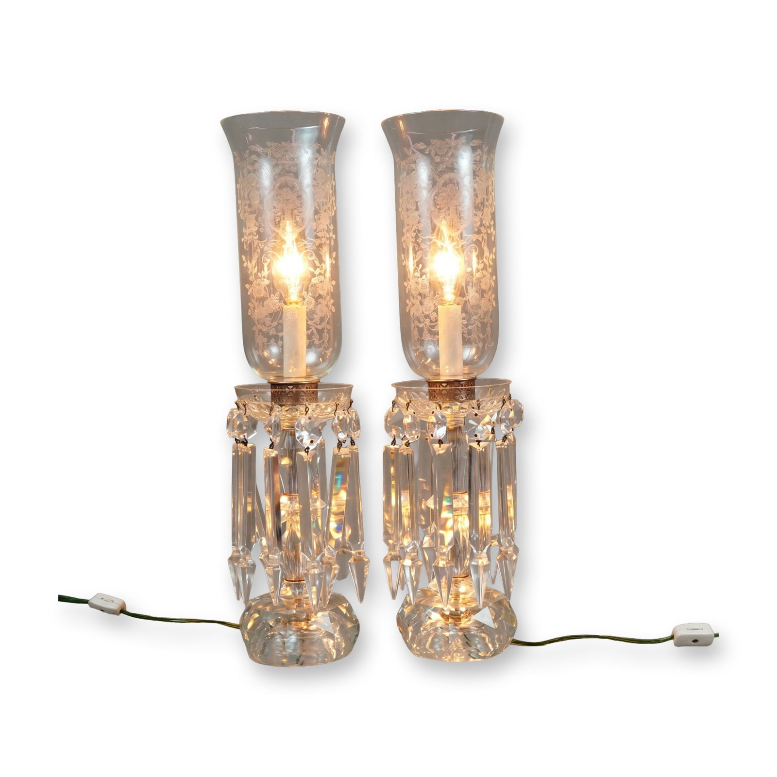 Pair of Vintage Electric Crystal Mantle Accent Lamps: Pair of vintage electric hurricane-style mantle accent lamps in faceted crystal and etched glass. Each lamp is constructed with a multi-faceted geometric-cut crystal base and pedestal. The lamps featu