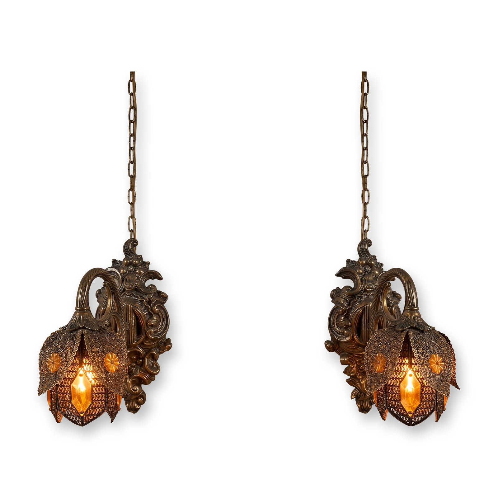 Loevsky & Loevsky Gilt Metal Jeweled Filigree Swag Sconces: Pair of Hollywood Regency style wall-mounted swag sconces in gilt-finished cast metal. Features ornate Rococo revival backplates with acanthus leaf and scroll motifs supporting a twisted rope C-arm. T
