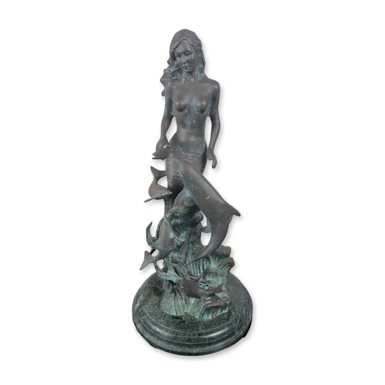 SPI Bronze Mermaid and Dolphins Sculpture: San Pacific International. Sculpture in cast metal with a verdigris patina, depicting a mermaid swimming among a pod of dolphins. The composition features stylized figures with textured surfaces, all 