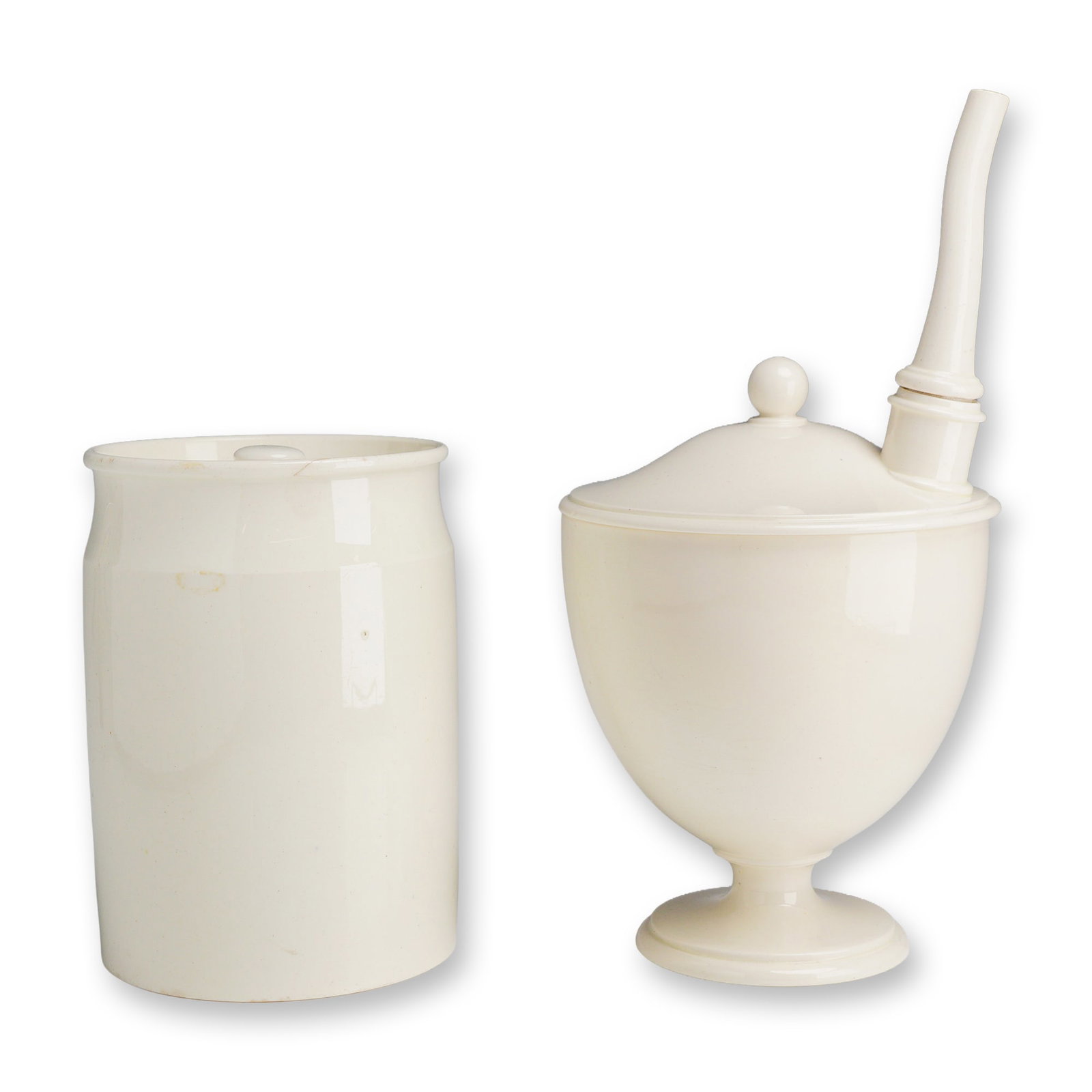 2pc Wedgwood Creamware Medical and Storage Vessels: This is a group of English creamware ceramic vessels manufactured by Wedgwood. The lot includes an invalid feeder, also known as a syphon cup, and a cylindrical storage jar. The feeder is a three-piec