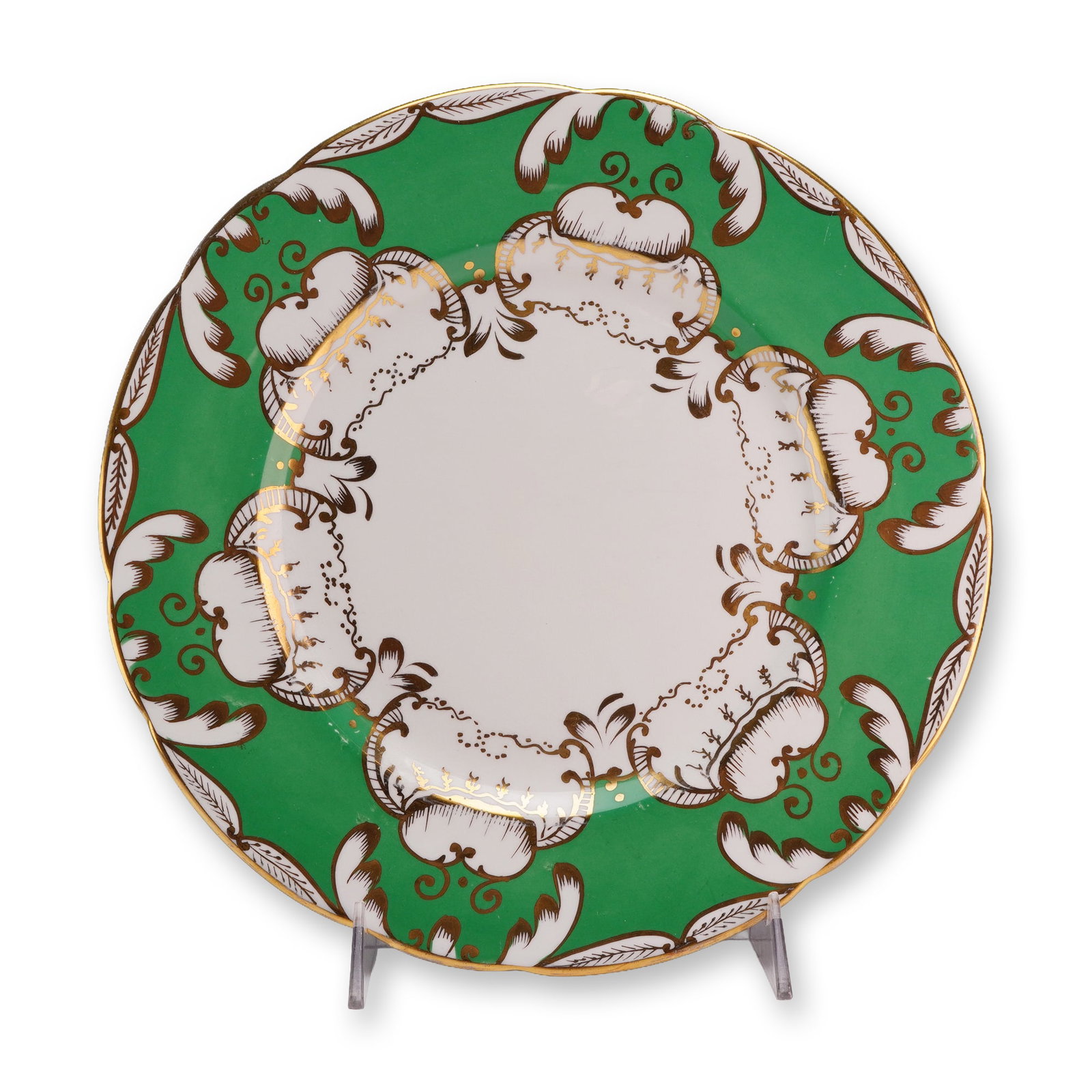 Royal Chelsea Porcelain Green Design Plate with Gilt Accents: Royal Chelsea English plate featuring a scalloped rim. The plate is decorated with a green border containing six white cartouches outlined in brown scrolling borders with hand-painted gilt accents.