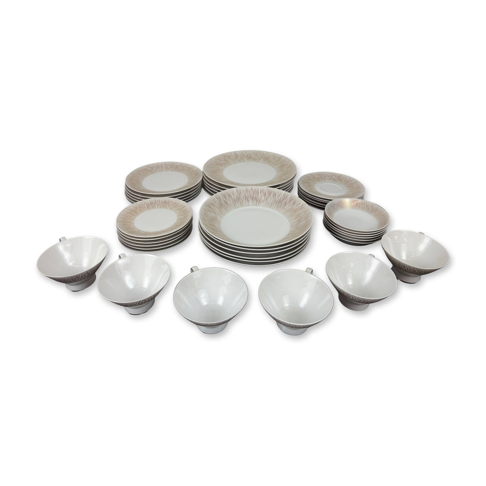 42-Piece Rosenthal Goldstrahlen Pattern Porcelain Dinnerware, Service for Six: Forty-two-piece dinner service in fine porcelain featuring the Goldstrahlen pattern. Decoration consists of fine radiating tan and gold lines on a white ground. Service includes six dinner plates 10",